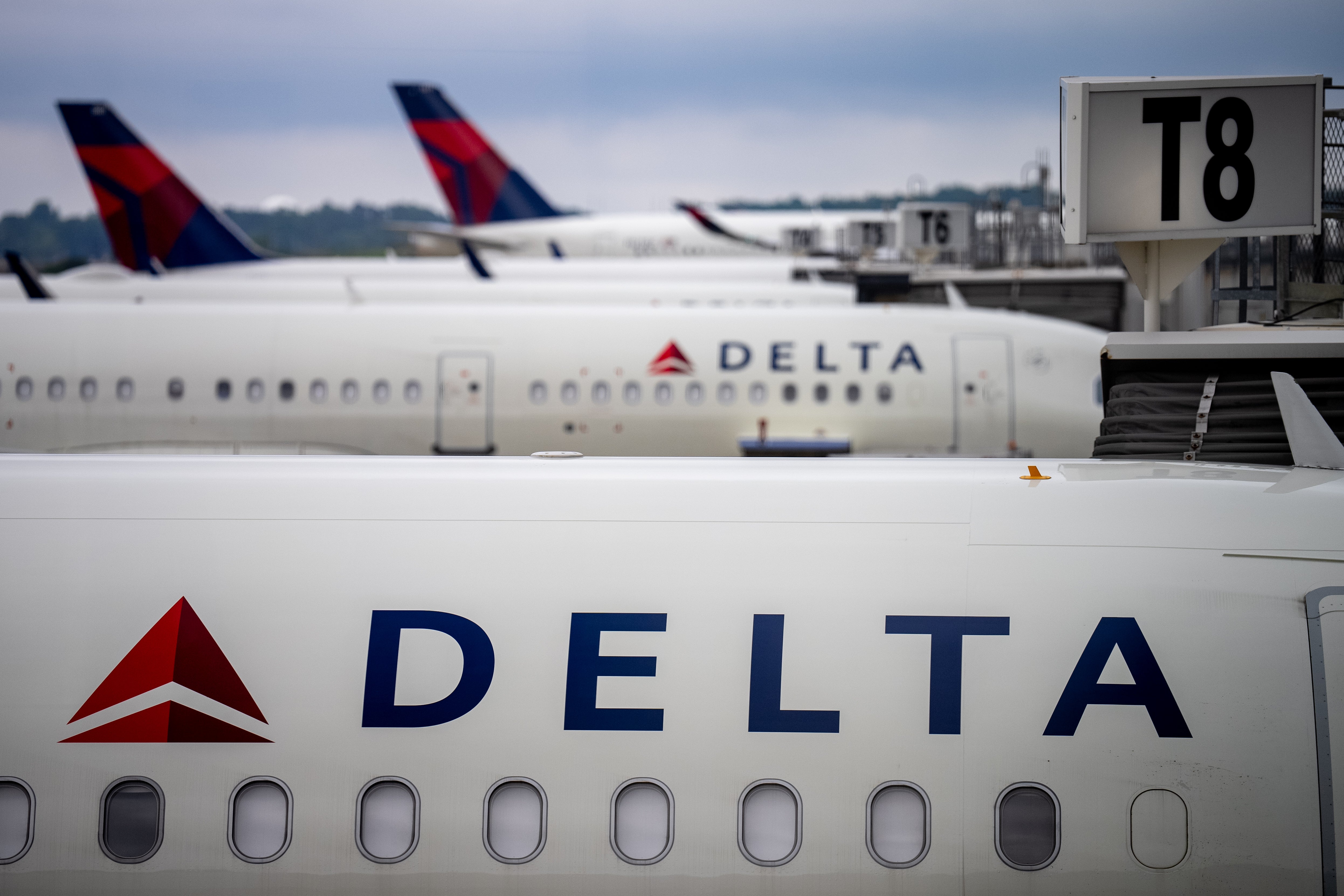Delta Airlines planes at Hartsfield-Jackson Atlanta International Airport in Atlanta, Georgia. The landing gear of a Delta Airlines flight carrying members of the Carolina Panthers slipped off the runway and became stuck in the mud shortly after the plane landed