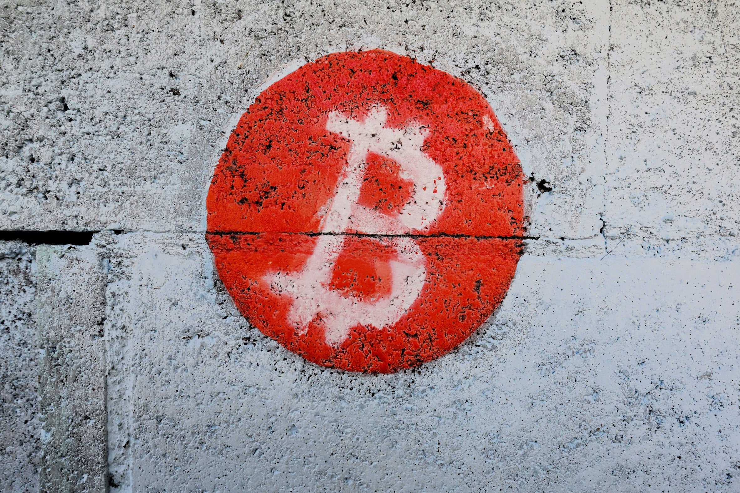 A bitcoin logo is seen on the wall in Playa Blanca, El Salvador, on 11 January, 2024