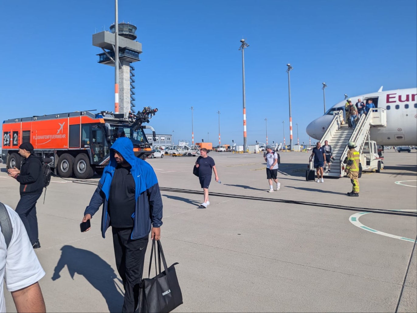 Going nowhere: Passengers on Eurowings EW8470 leaving the Airbus aircraft at Berlin airport after it made an emergency landing