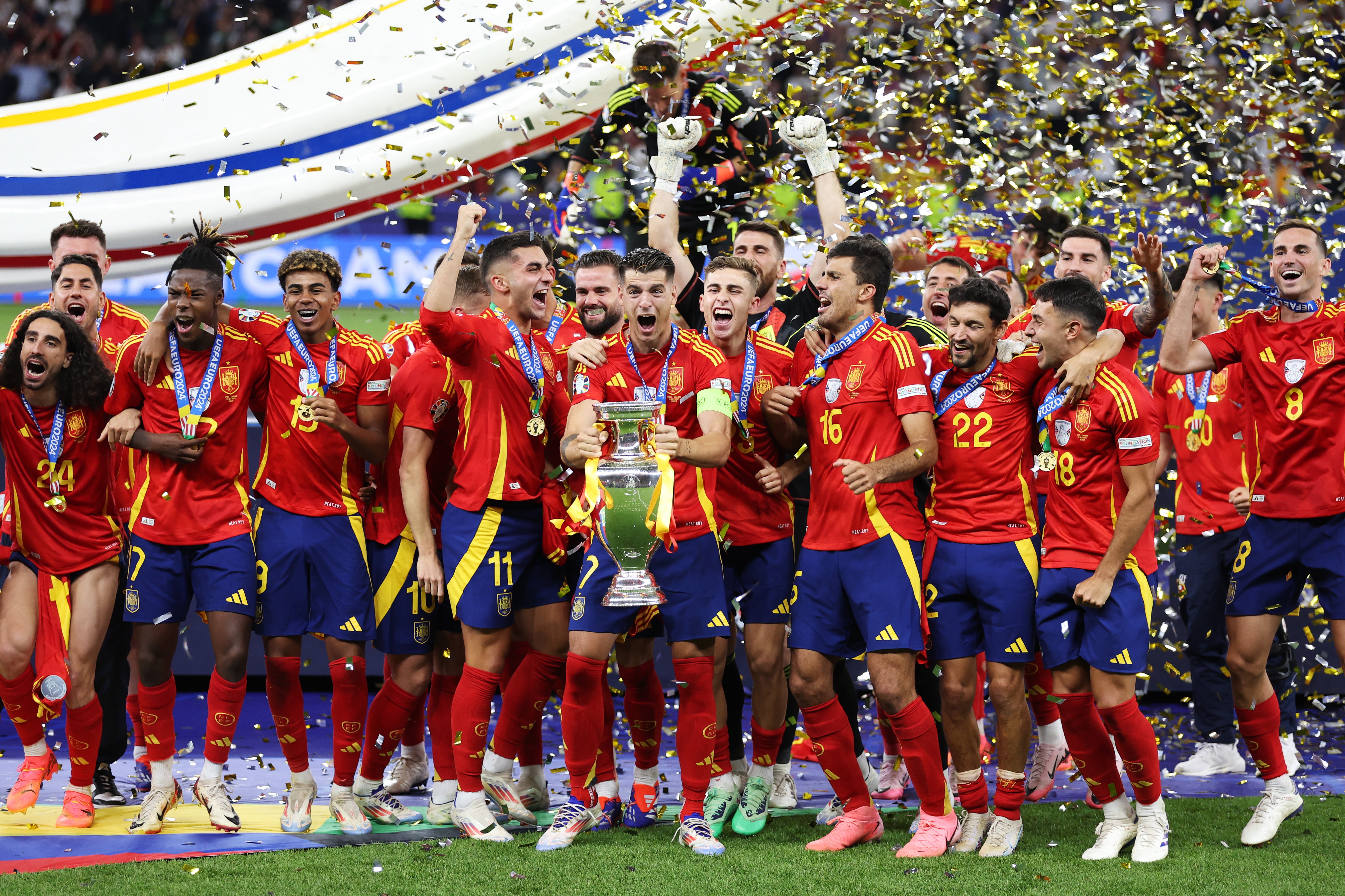 Alvaro Morata lifts the trophy for Spain