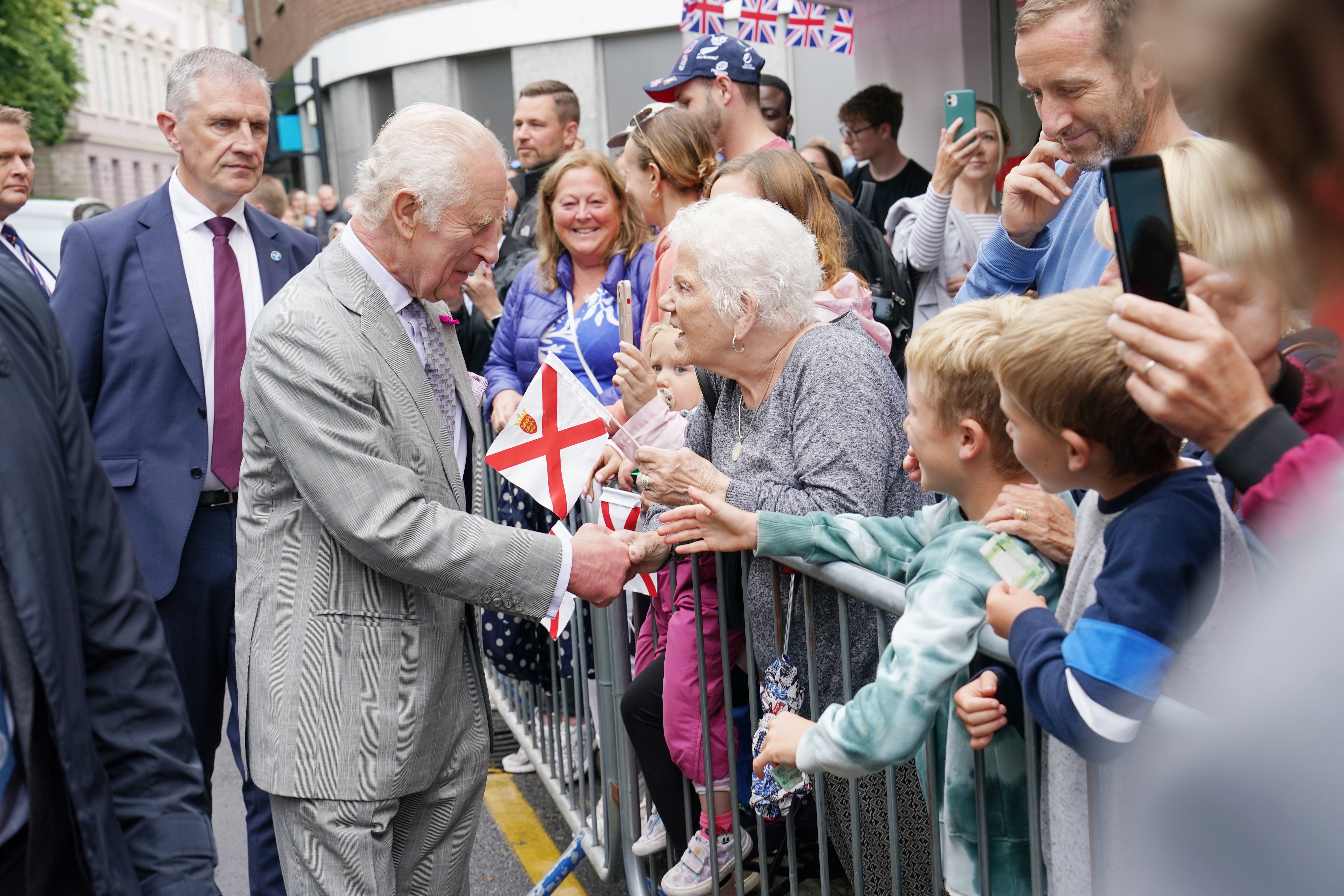 Charles speaks to members of the public as he arrives at the Royal Square in St Helier, Jersey (Arthur Edwards/The Sun/PA)