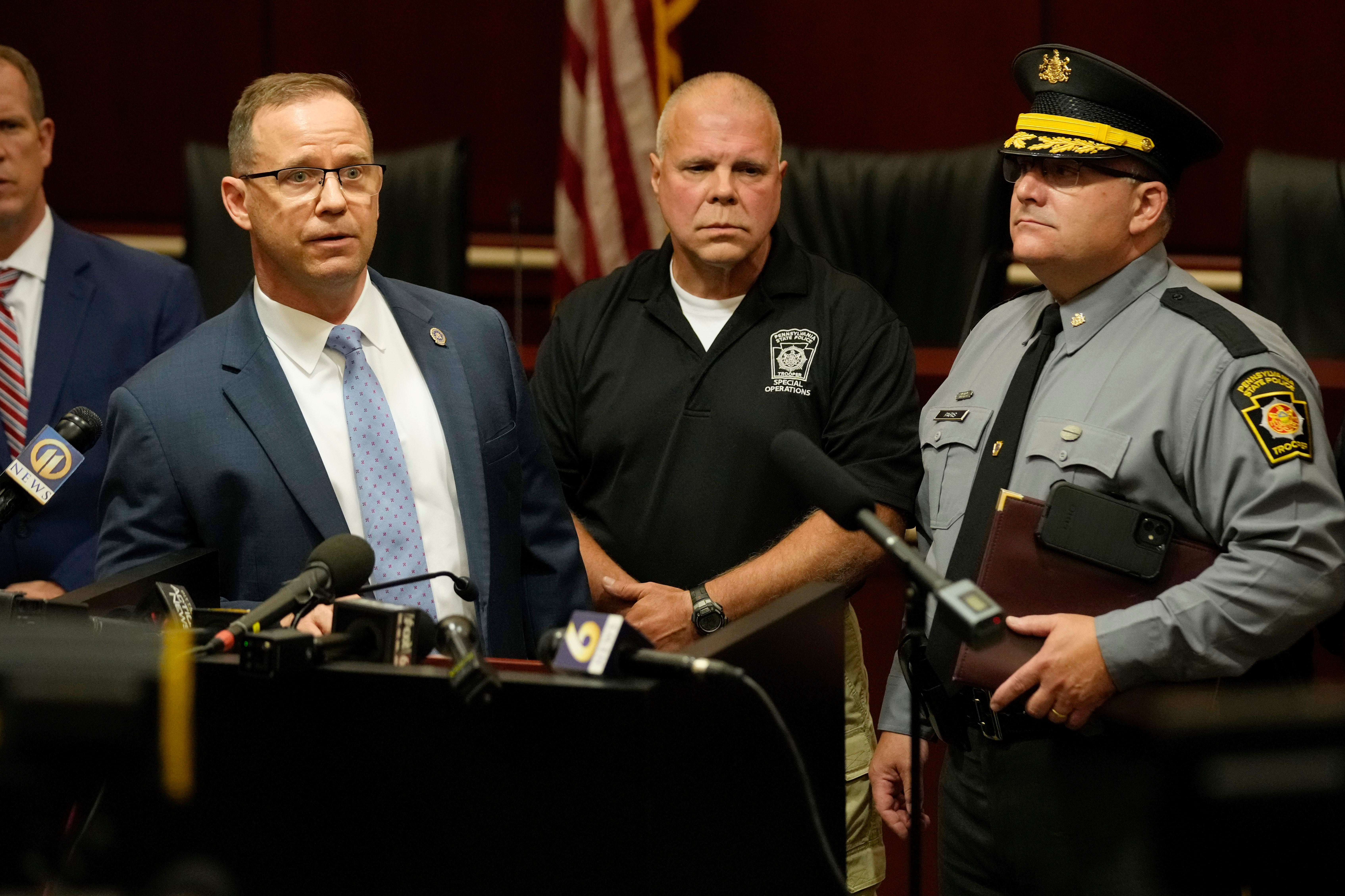 Kevin Rojek, left, FBI special agent in charge, Lt. Col. George Givens, center, Pennsylvania State Police, and Col. Christopher Paris, right, Pennsylvania State Police, answer questions at a news conference concerning the assassination attempt on former President Donald Trump.