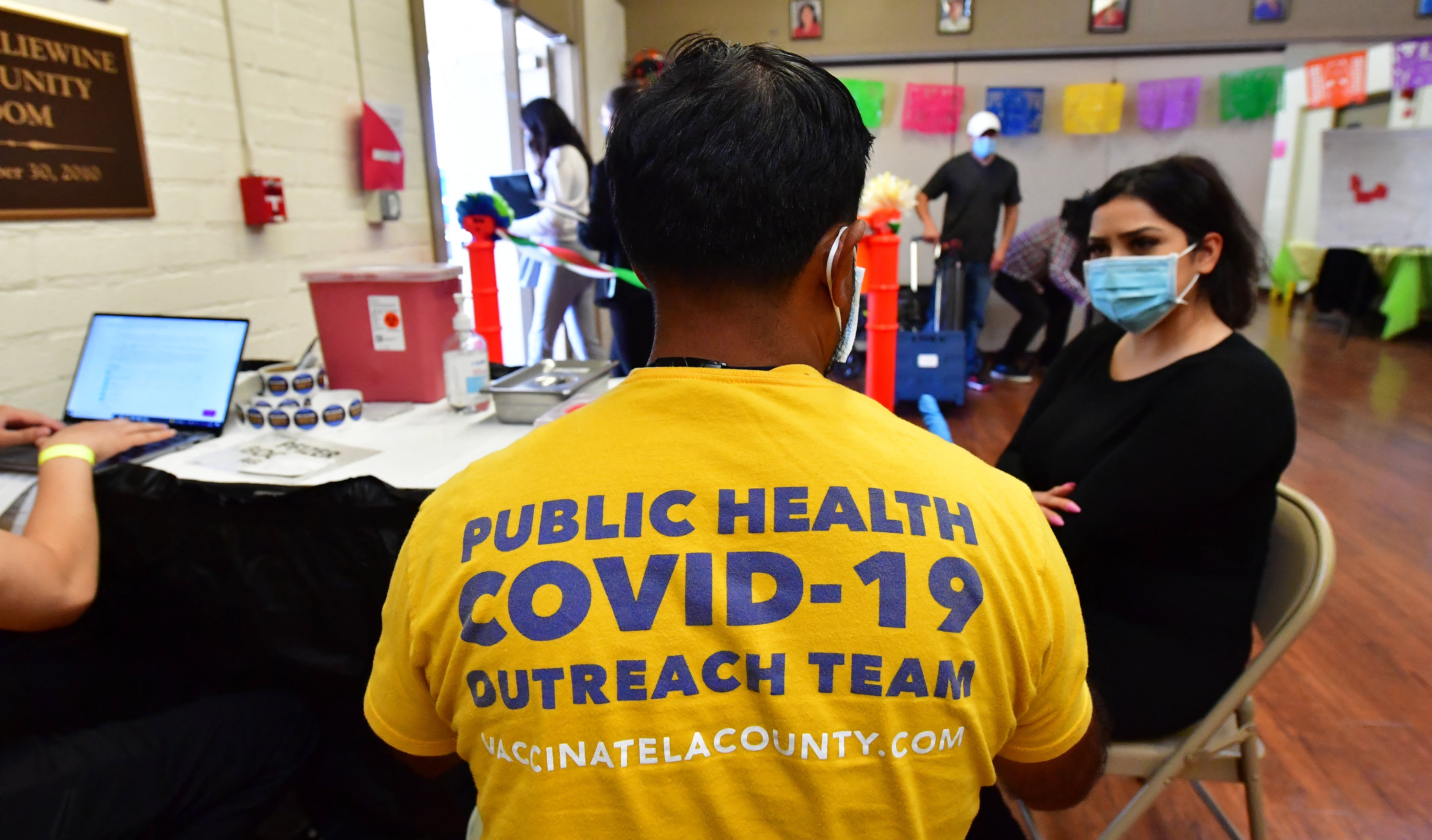 A woman receives her booster shot at a Covid vaccination center in Los Angeles in 2022. The US reached ‘high’ levels of Covid in wasterwater for first time this summer, according to the CDC