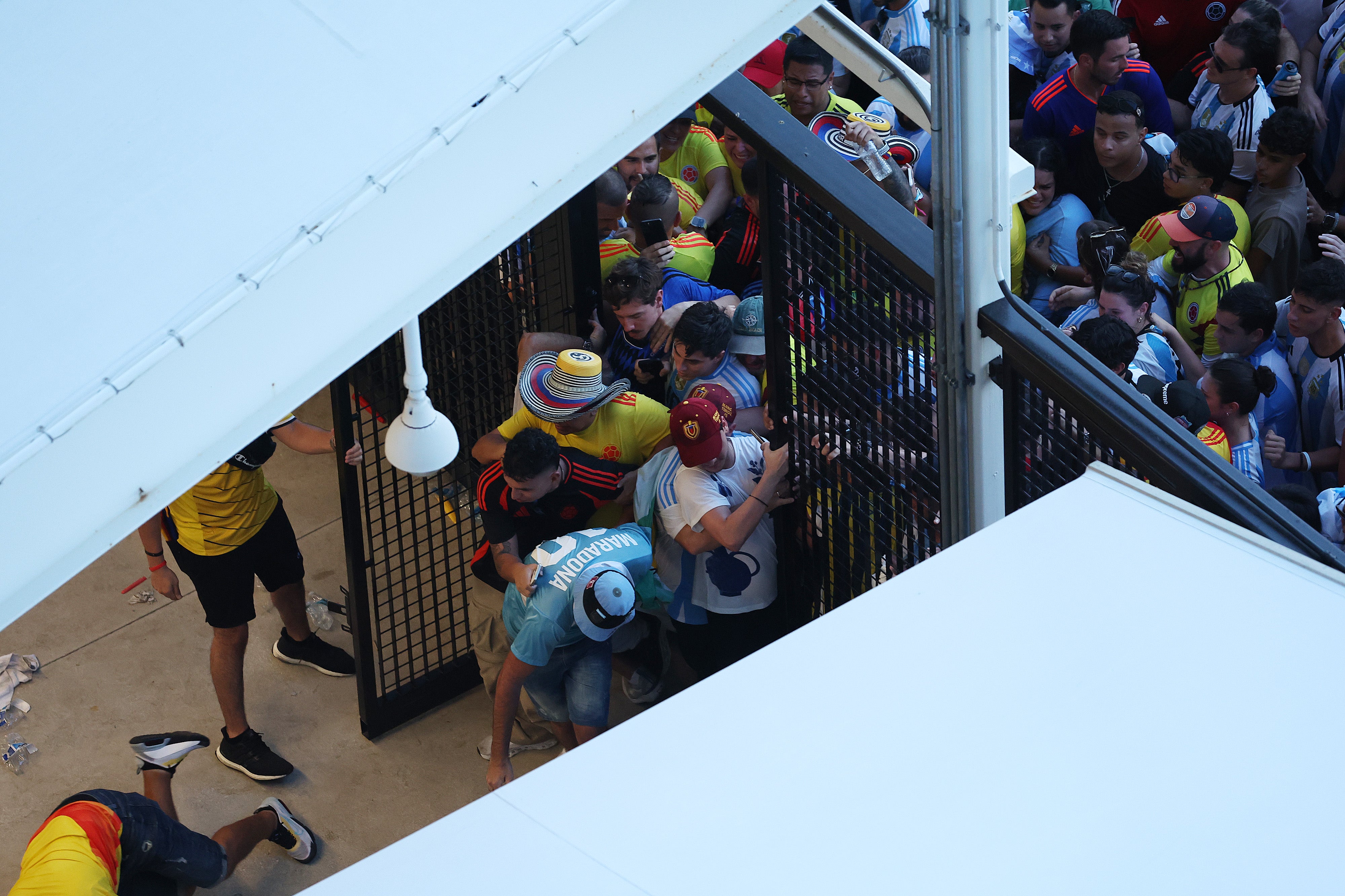 Large crowds of fans try to enter the stadium