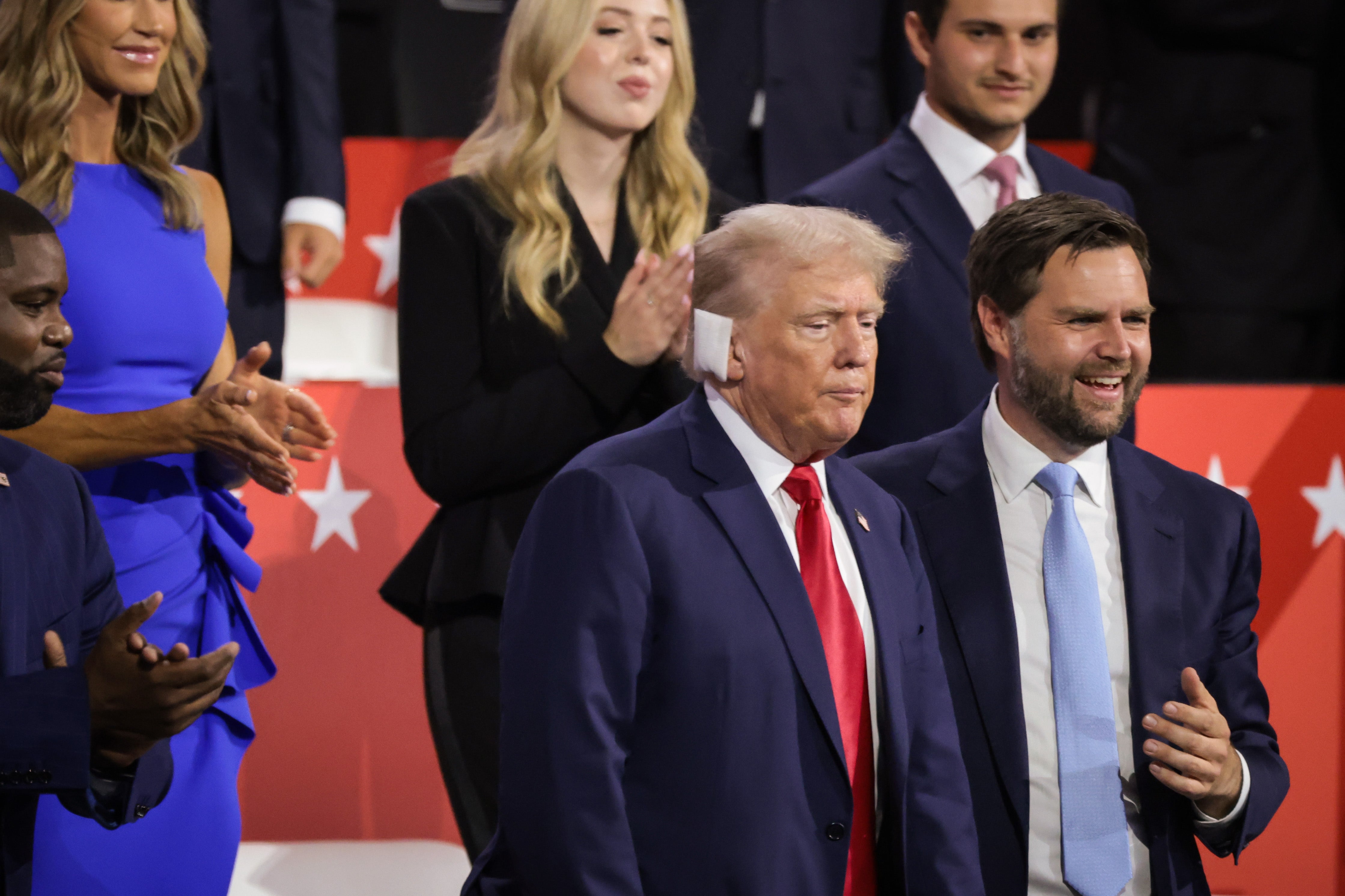 Donald Trump, with a bandaged ear, and JD Vance appear on the first day of the Republican National Convention