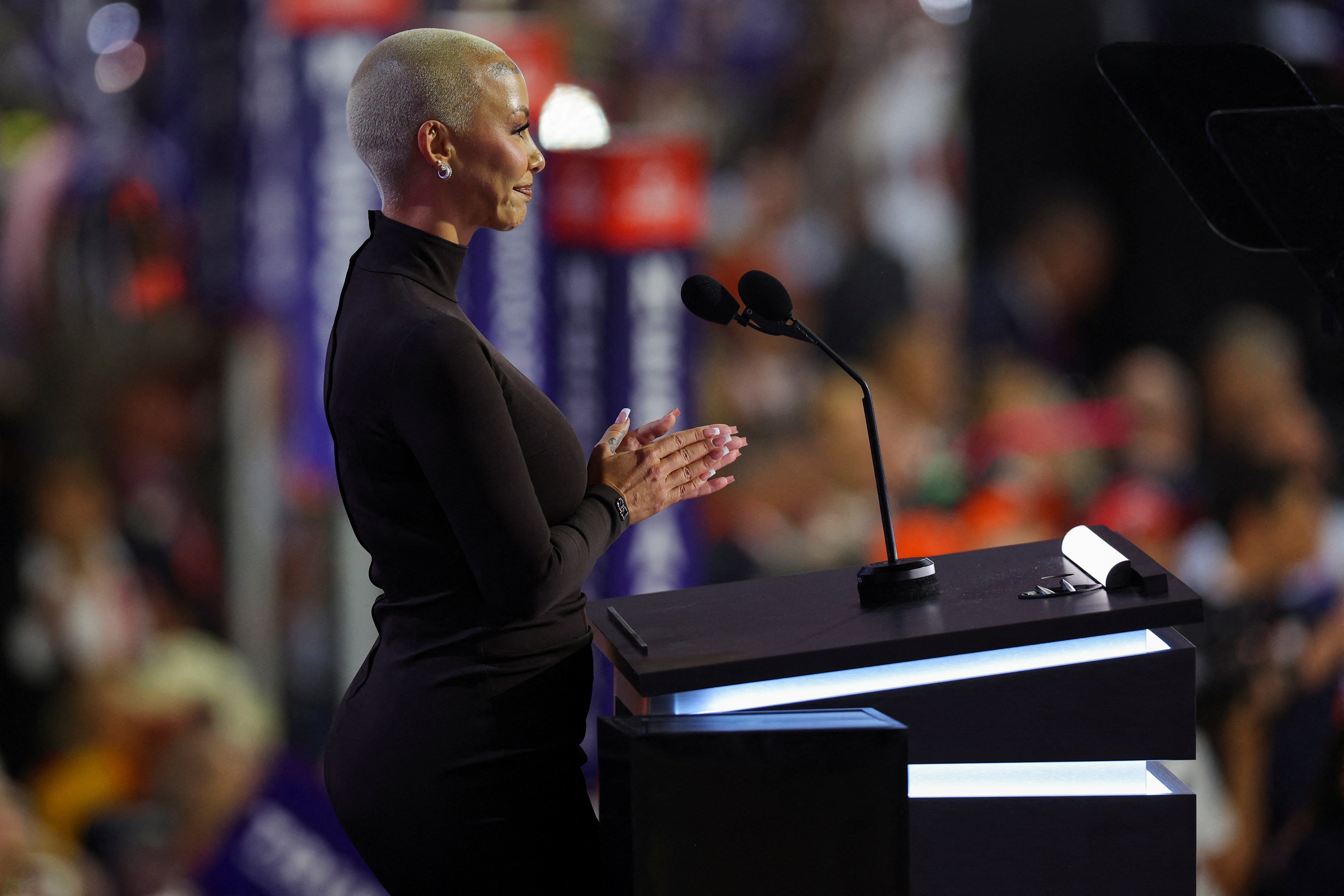 Amber Rose speaks at the RNC as Donald Trump watches on from the audience