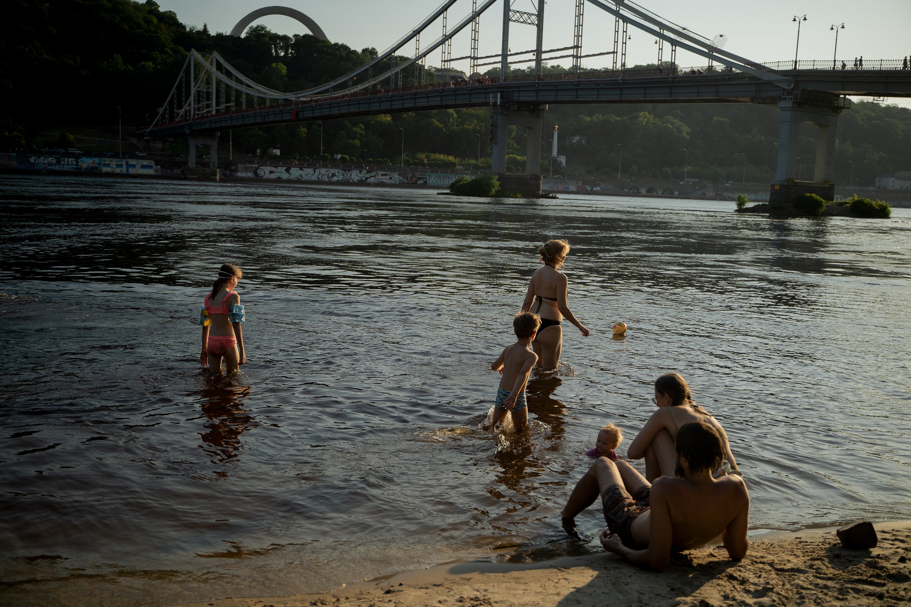 People relax on the town beach on July 14, 2024 in Kyiv, Ukraine. Ukraine has been suffering from extreme heat for the past few weeks.