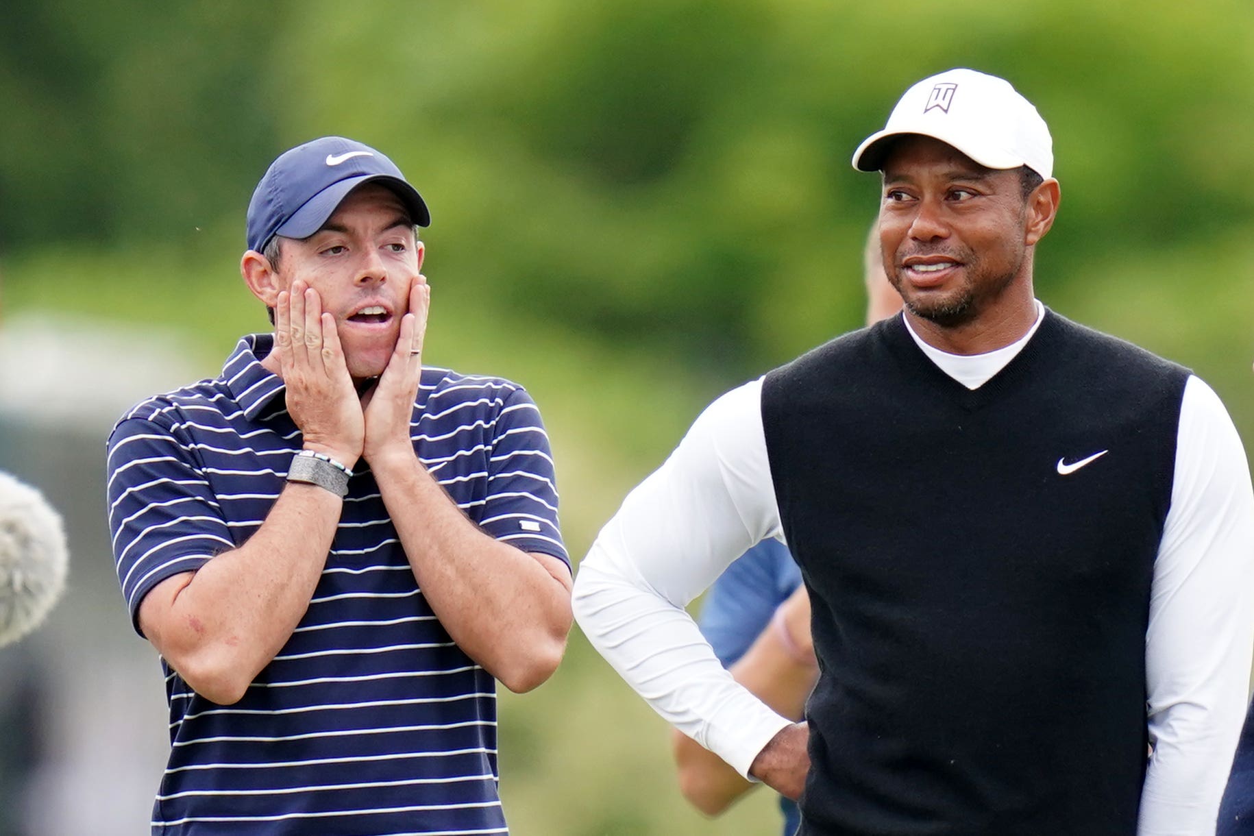 Tiger Woods (right) knows Rory McIlroy will have to deal with ‘raw emotion’ after the US Open for some time (Jane Barlow/PA)