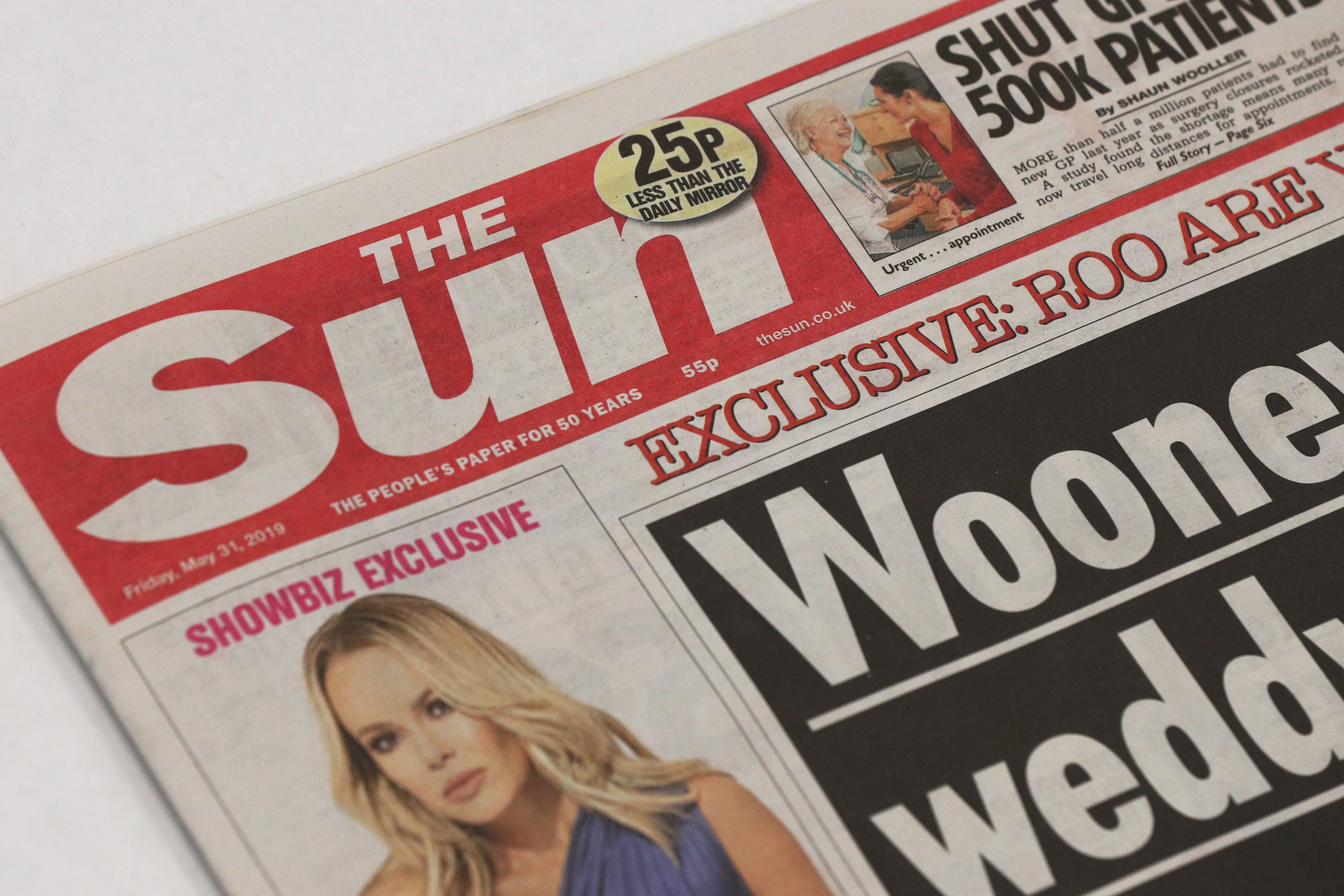 Dozens of people face a months-long wait to find out whether their case against News Group Newspapers, the publisher of the Sun, will go to trial (PA)