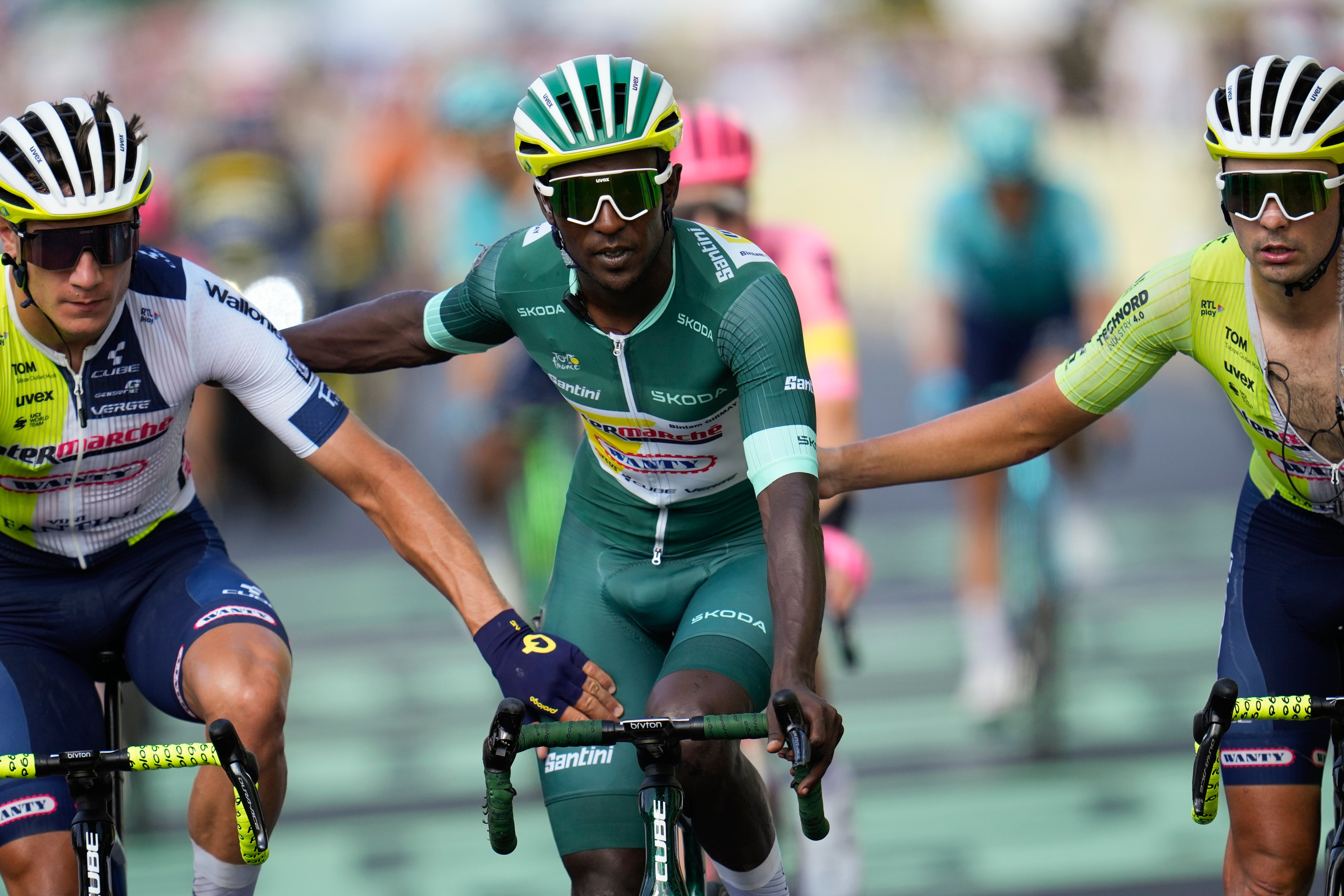 Biniam Girmay was nursed over the finish line by his team-mates after falling in a late crash (Jerome Delay/AP)