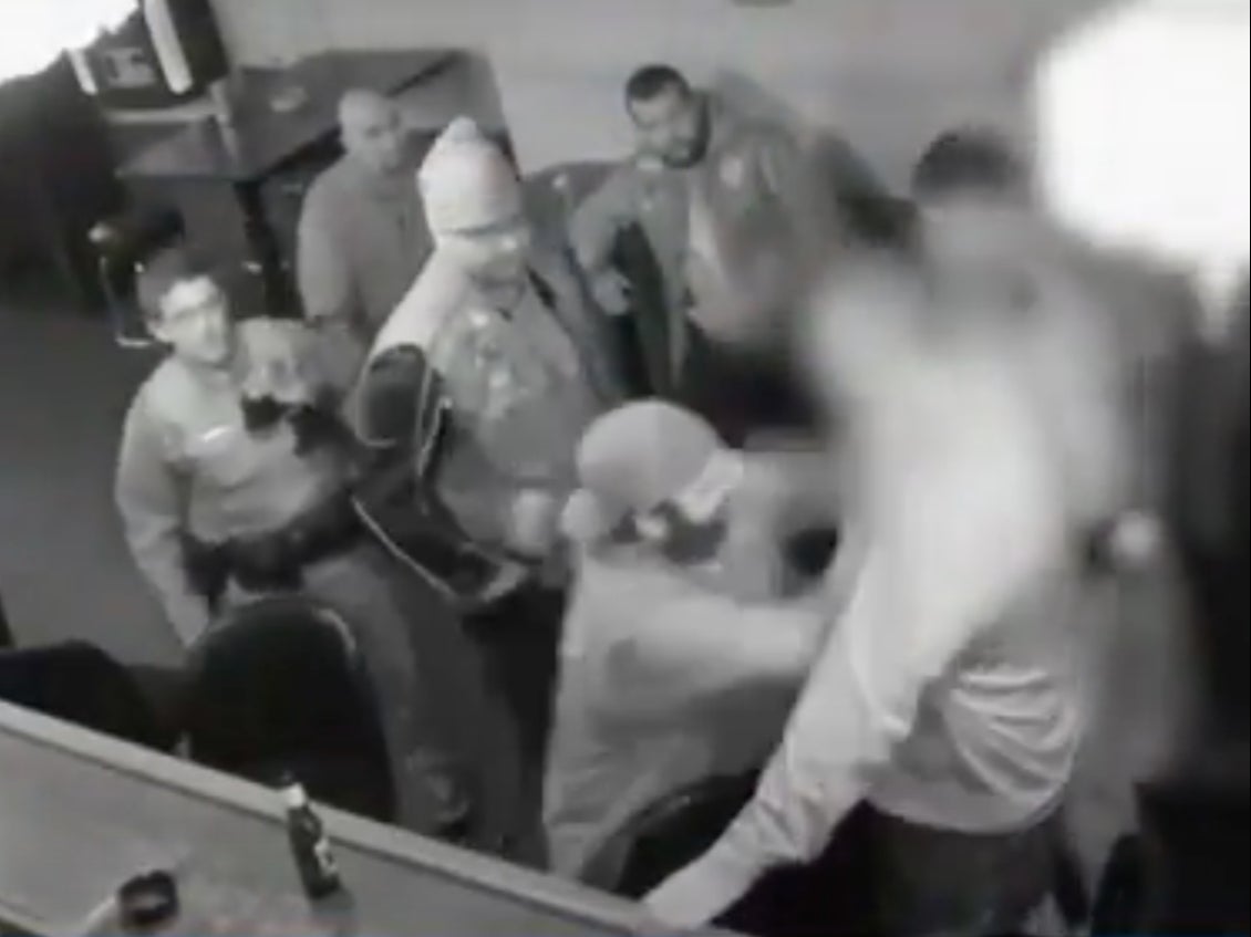 Surveillance footage shows Frank Deluca of the Pagans Motorcycle Club fighting with an undercover Pittsburgh police officer inside Kopy’s bar