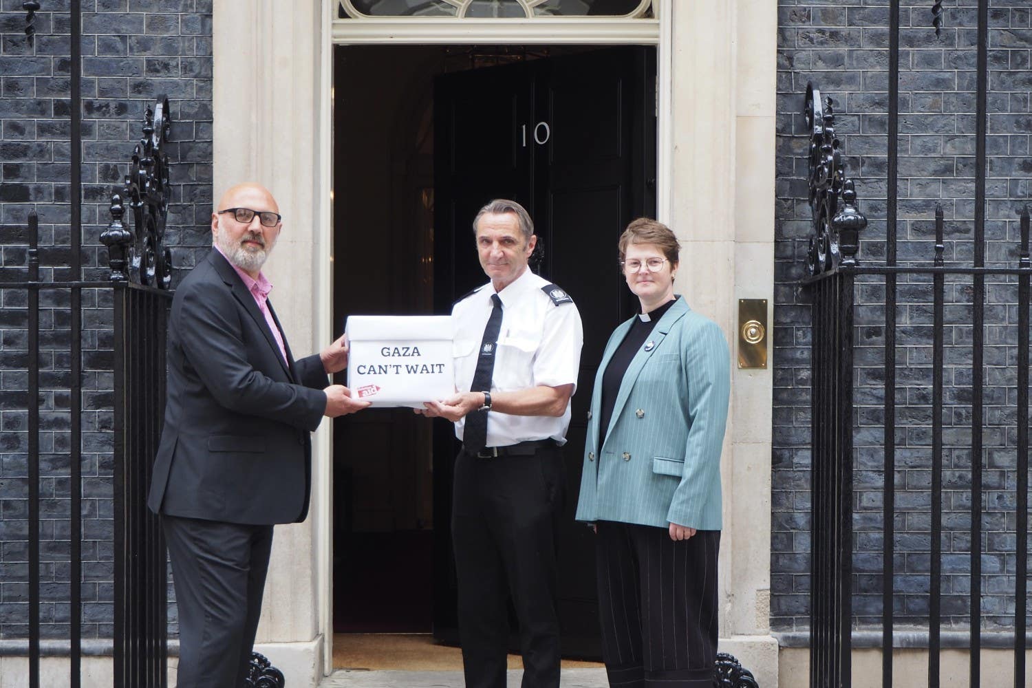 Ray Hasan and Reverend Claire Whitmore delivering letters from Palestinian children (PA)