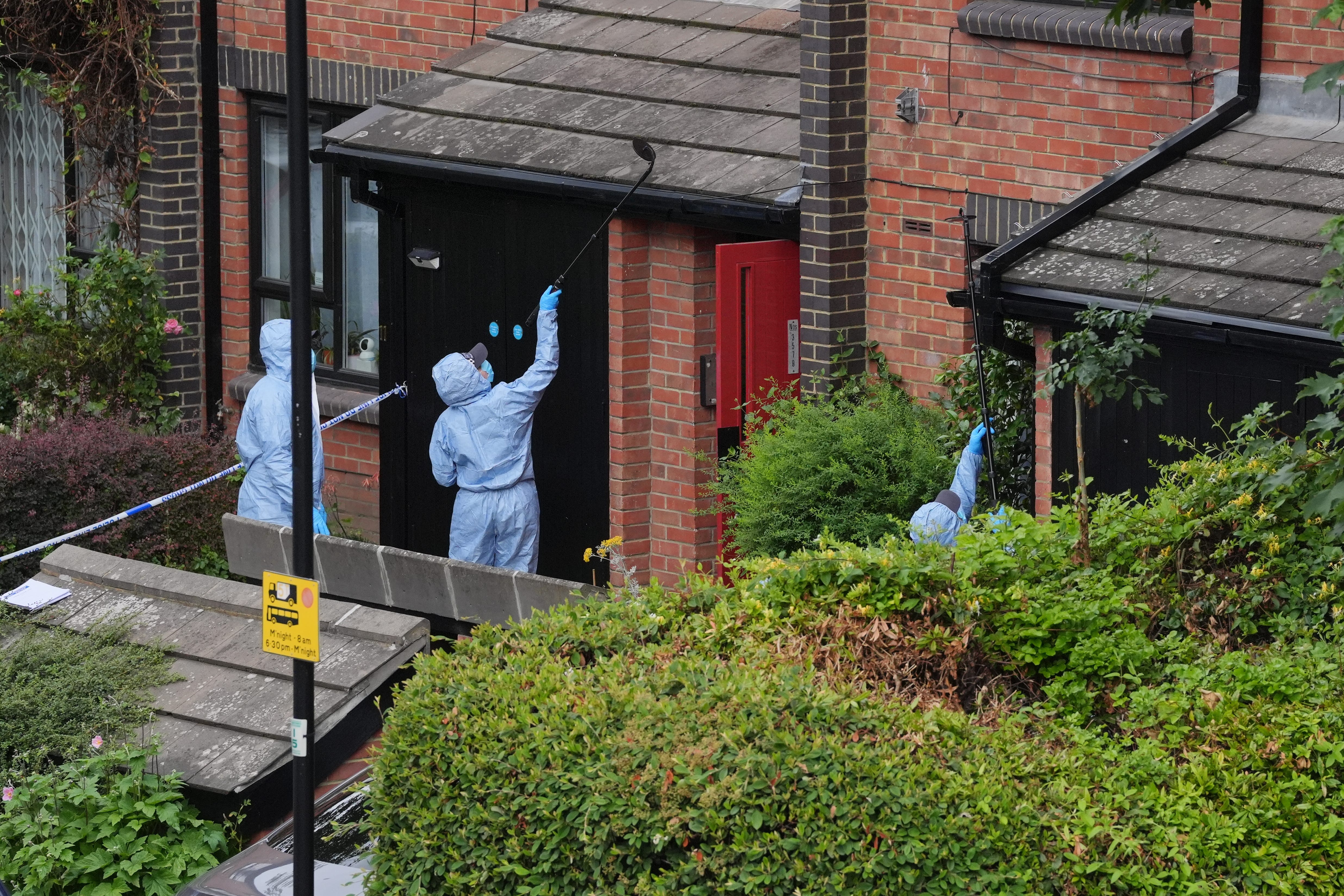 Forensic officers at an address in Shepherd’s Bush, west London (Jonathan Brady/PA)