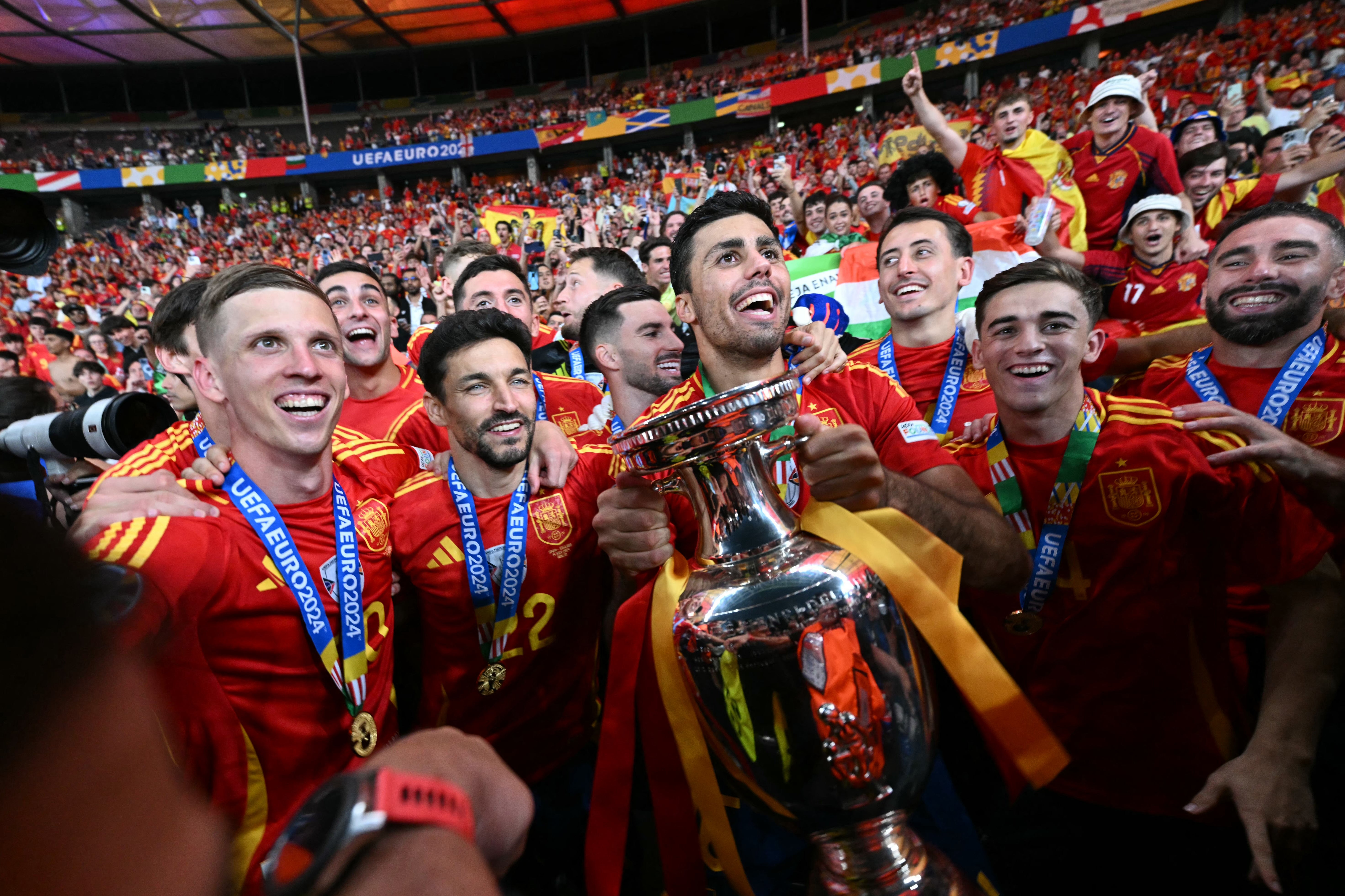 Spain players celebrate with the European Championship trophy