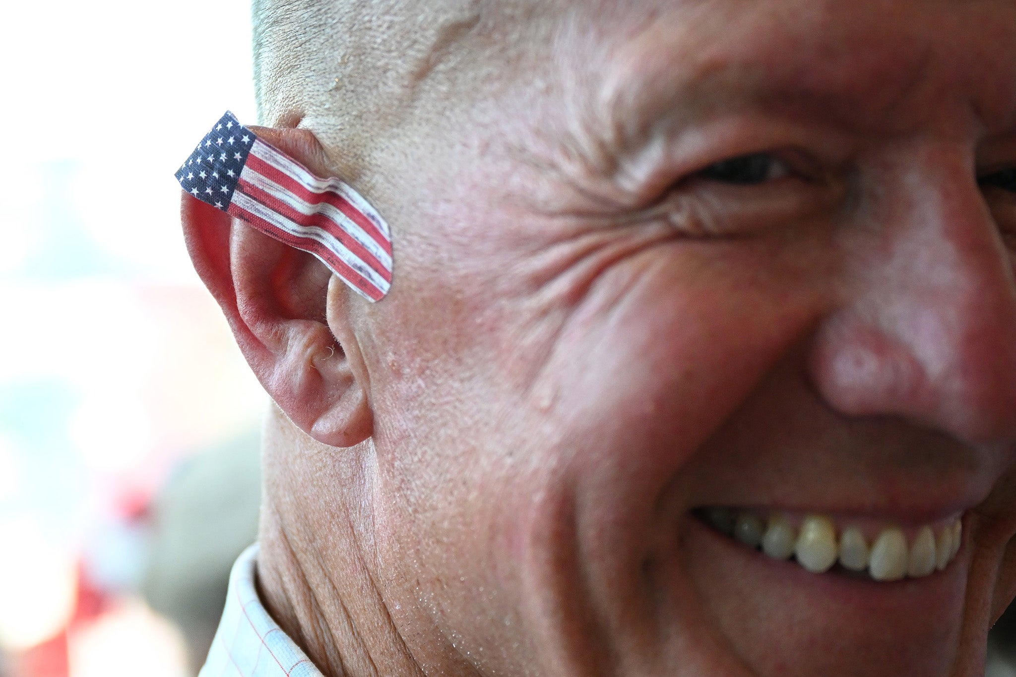 A man sports an American flag band-aid on the first day of the convention