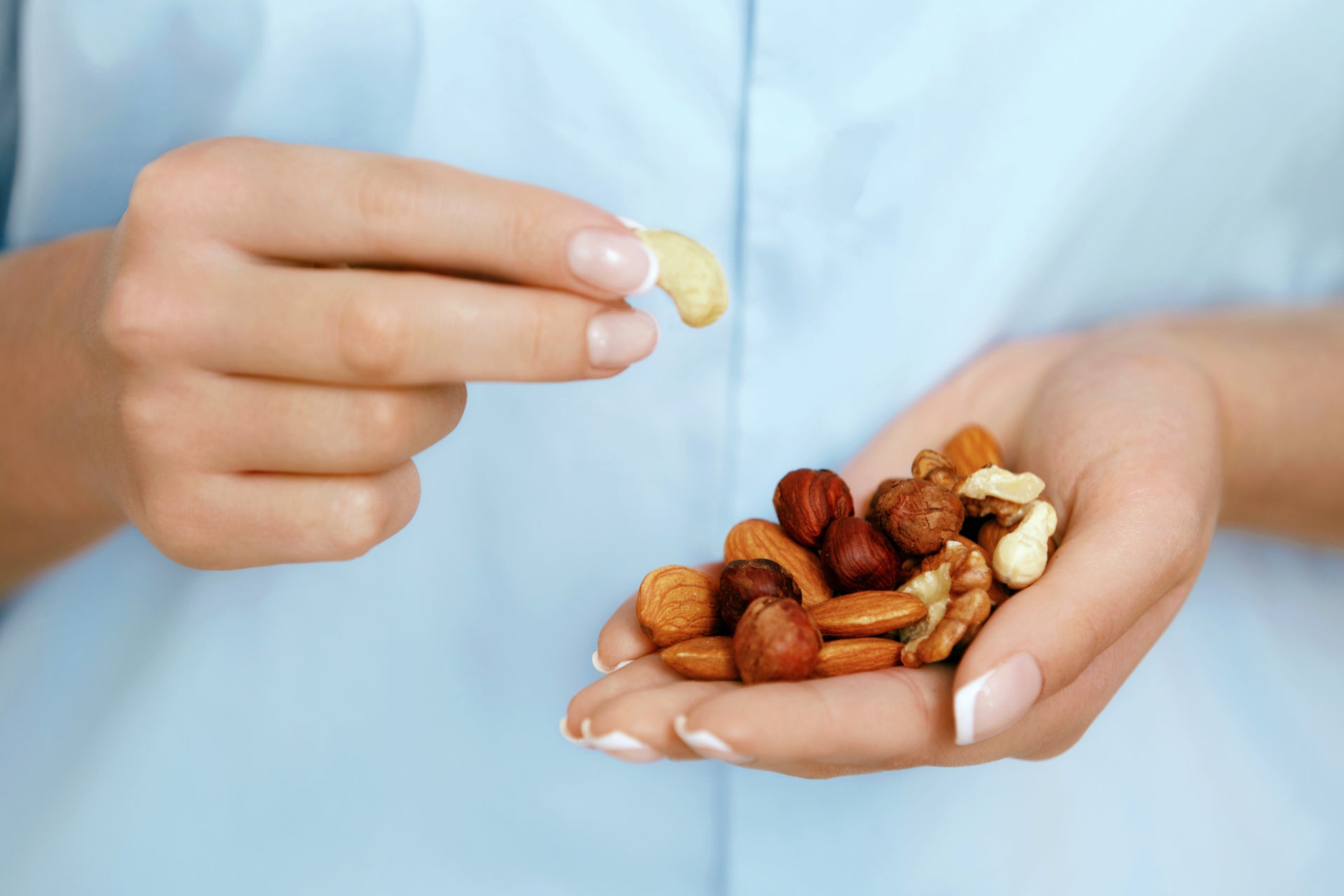 Slim pickings: a woman tucks into an alleged snack of nuts