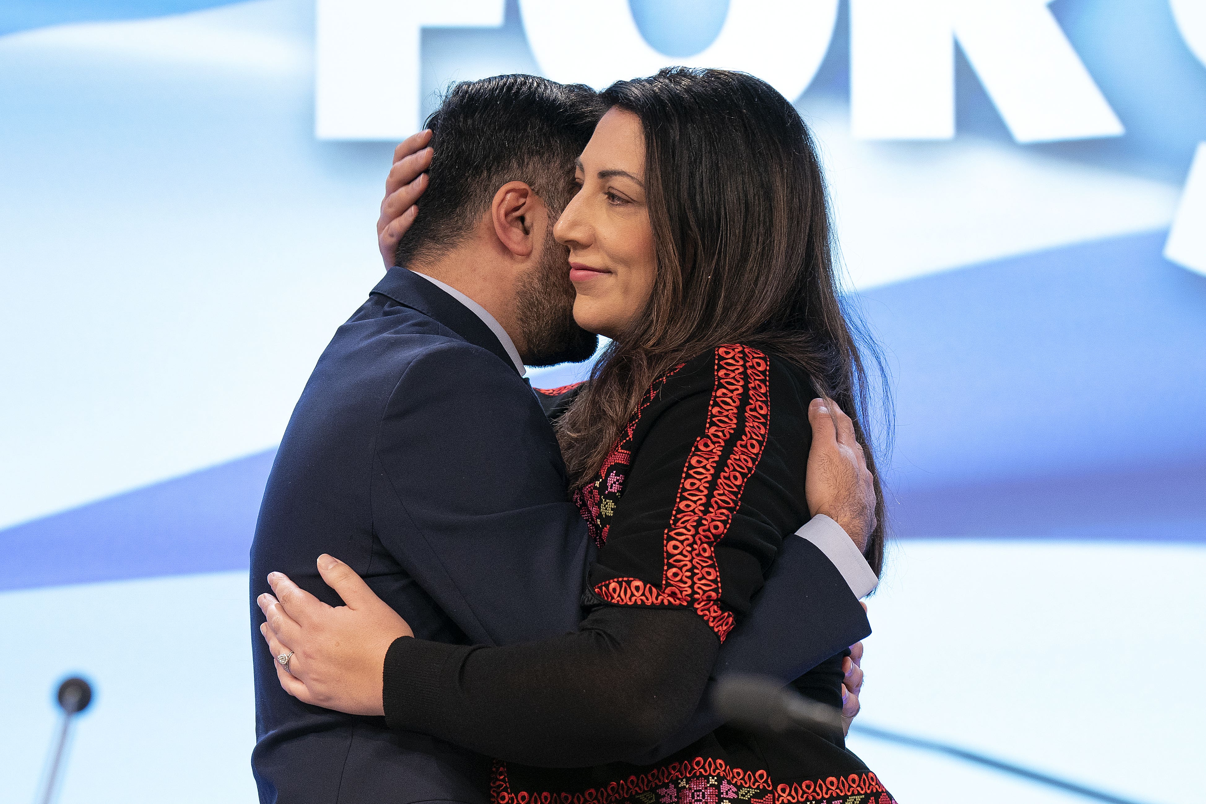 Former first minister Humza Yousaf embraces his wife, Nadia El-Nakla. (Jane Barlow/PA)