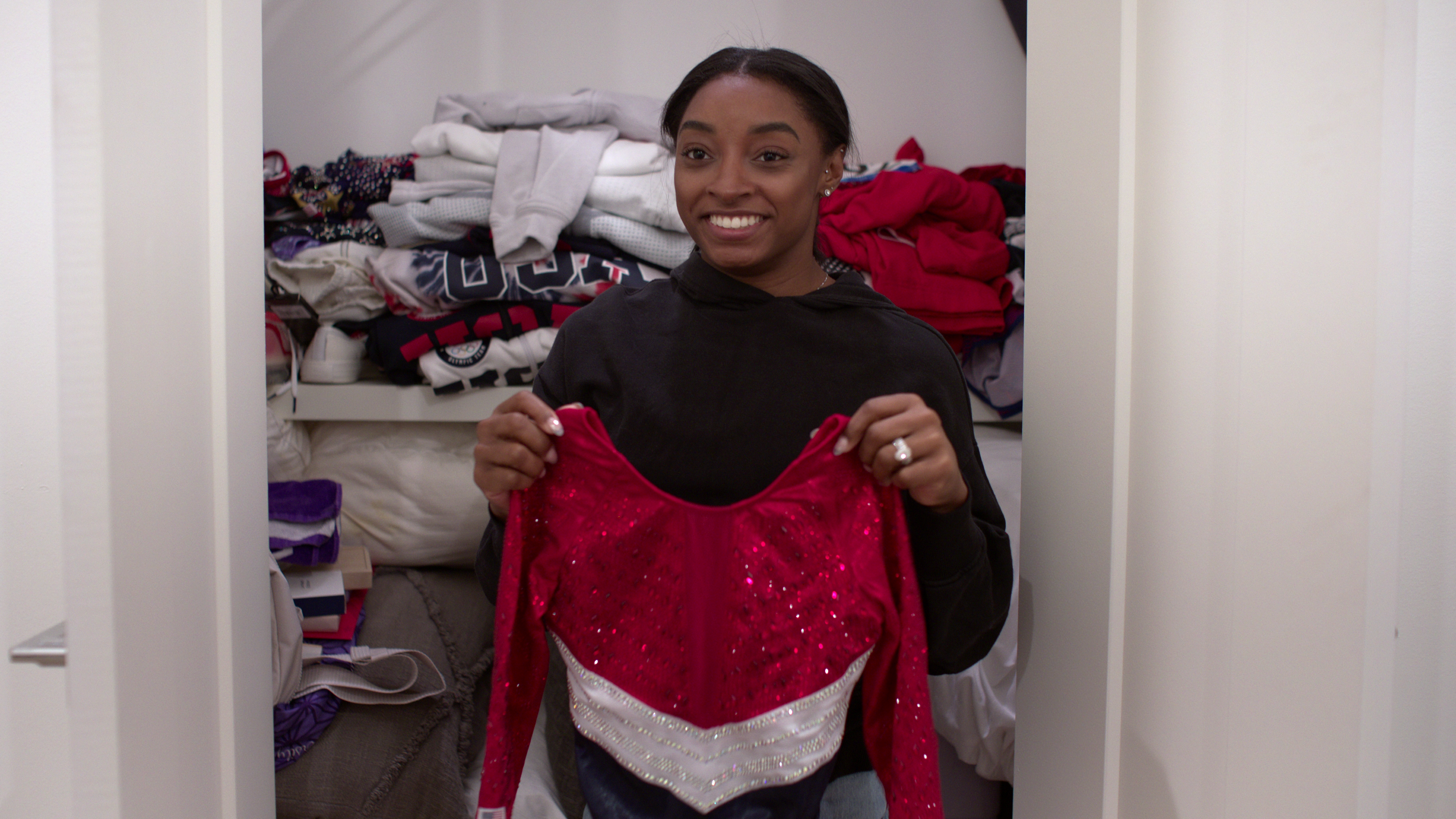 Biles looks through her forbidden Tokyo 2020 Olympics closet full of memorabilia