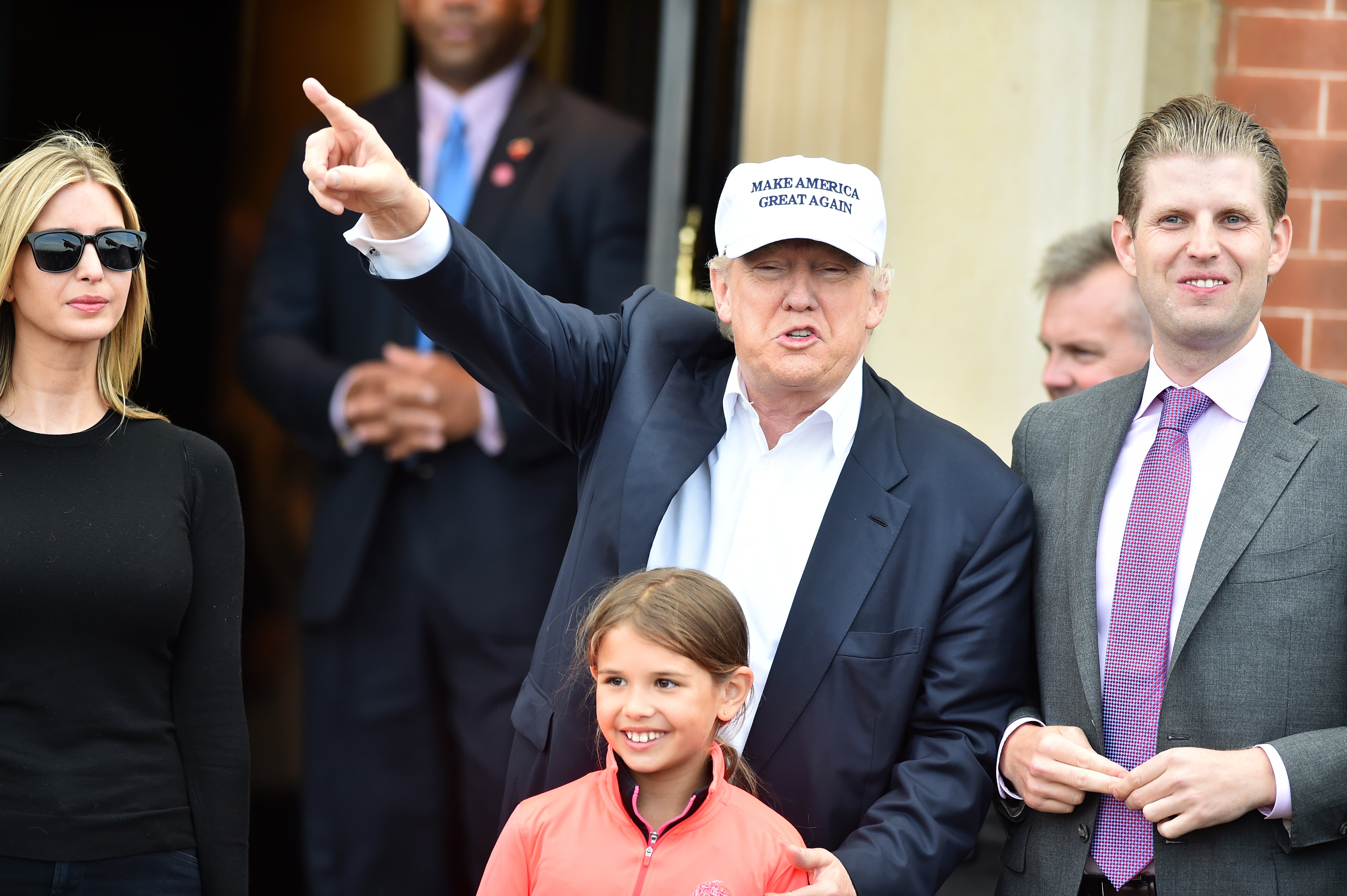 Trump surround by family members Eric , Kai and Ivanka Trump at the Trump Turnberry Resort on June 24, 2016 in Ayr, Scotland