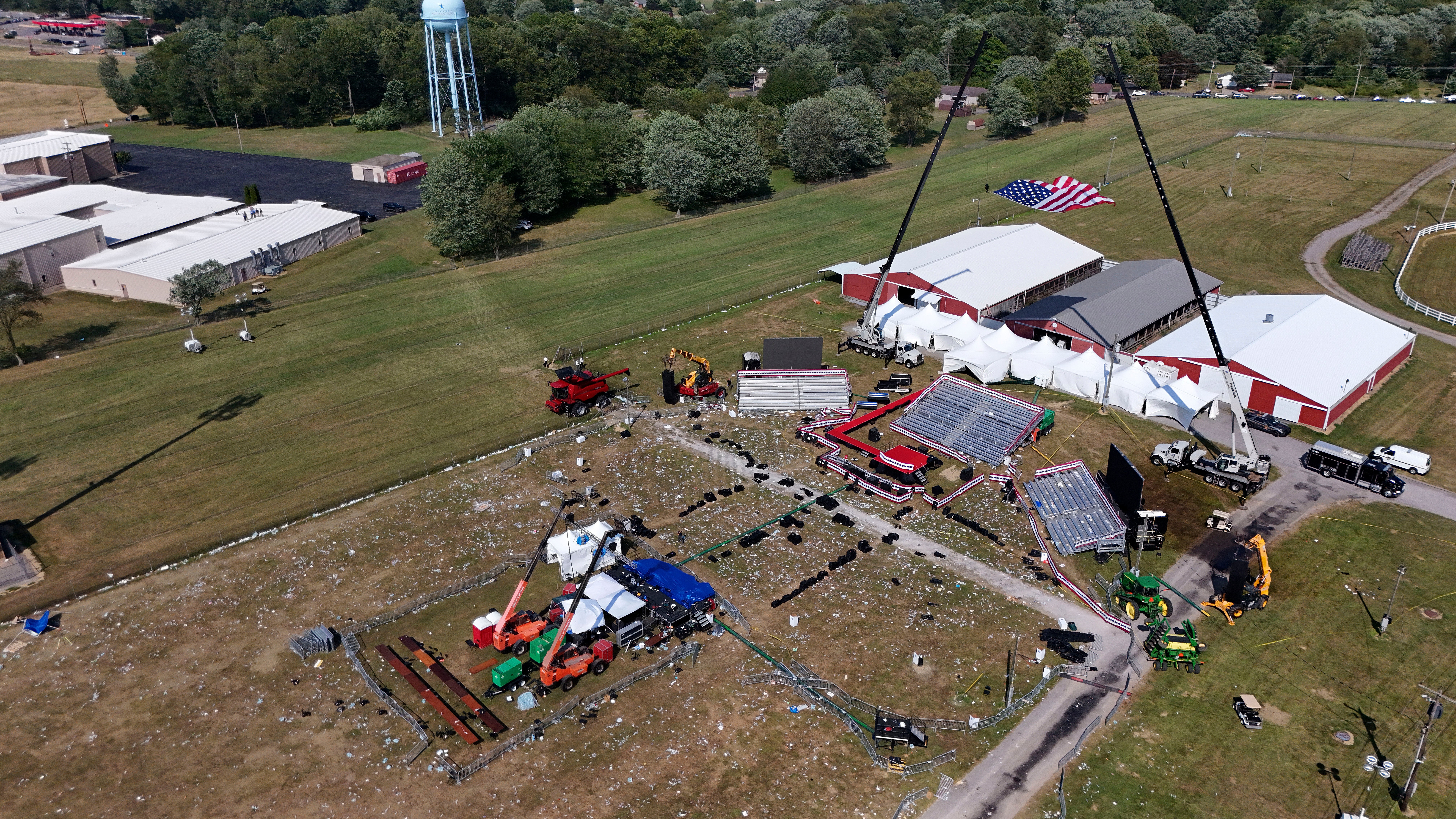 This aerial photo of the Butler Farm Show, site on July 13. It shows the aftermath after a gunman opened fire on Trump during a rally. Now, Secret Service failures are being highlighted in a new report