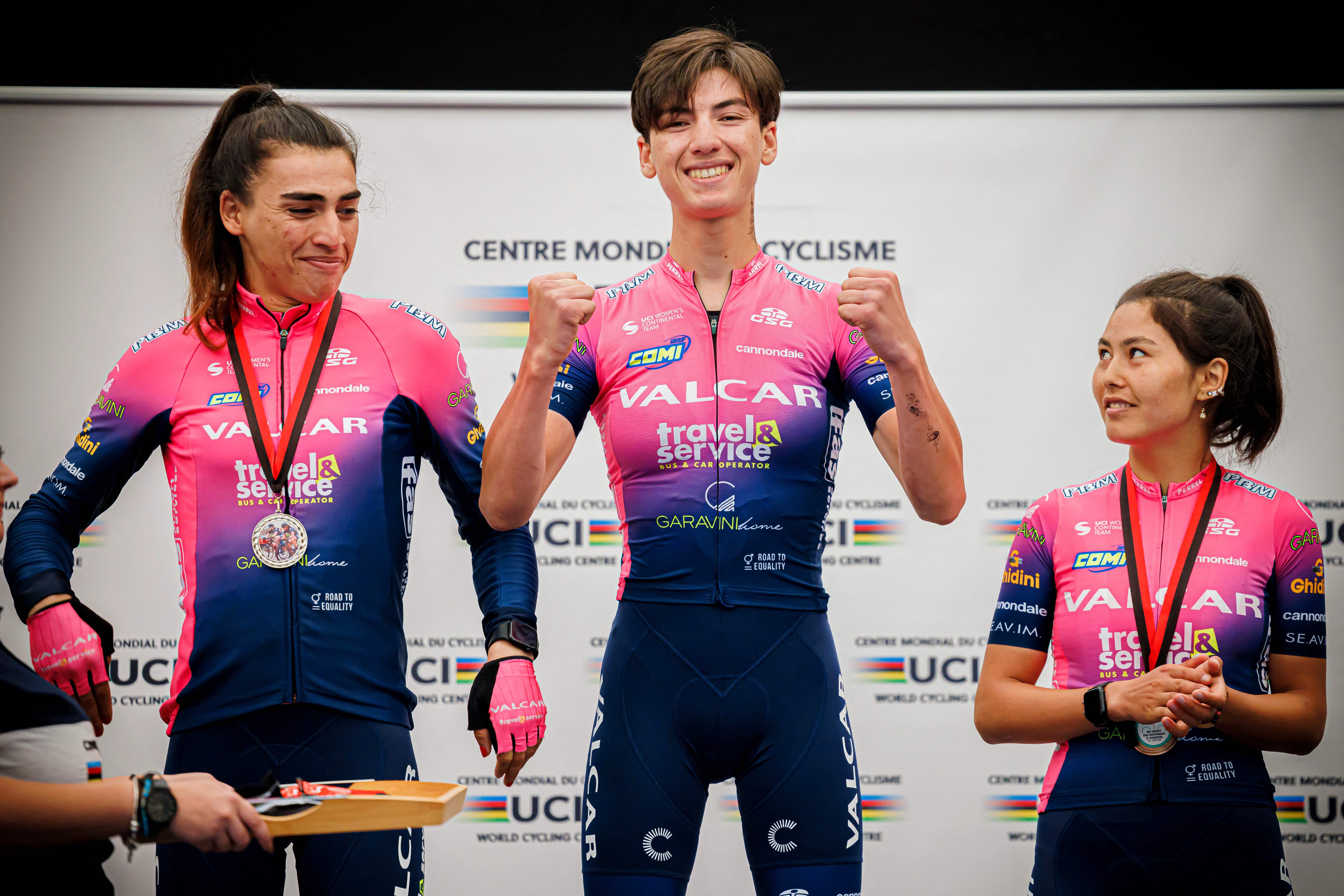 Yulduz Hashimi, Fariba Hashimi and Zahra Rezayee pose on the podium of the 2022 women’s road cycling competition at the Asia Championship of Afghanistan in Aigle, Switzerland