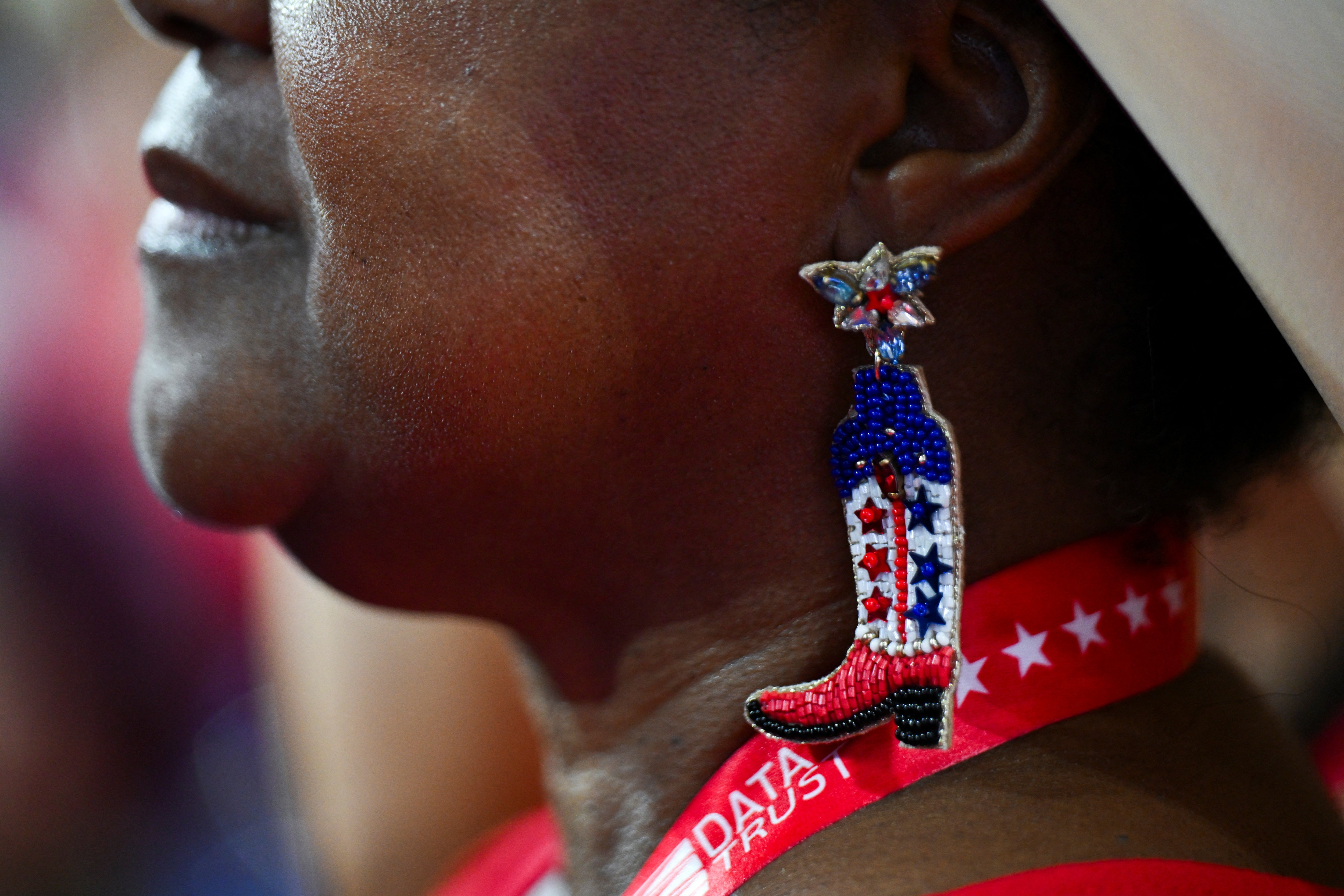 A delegate wearing cowboy boot earrings