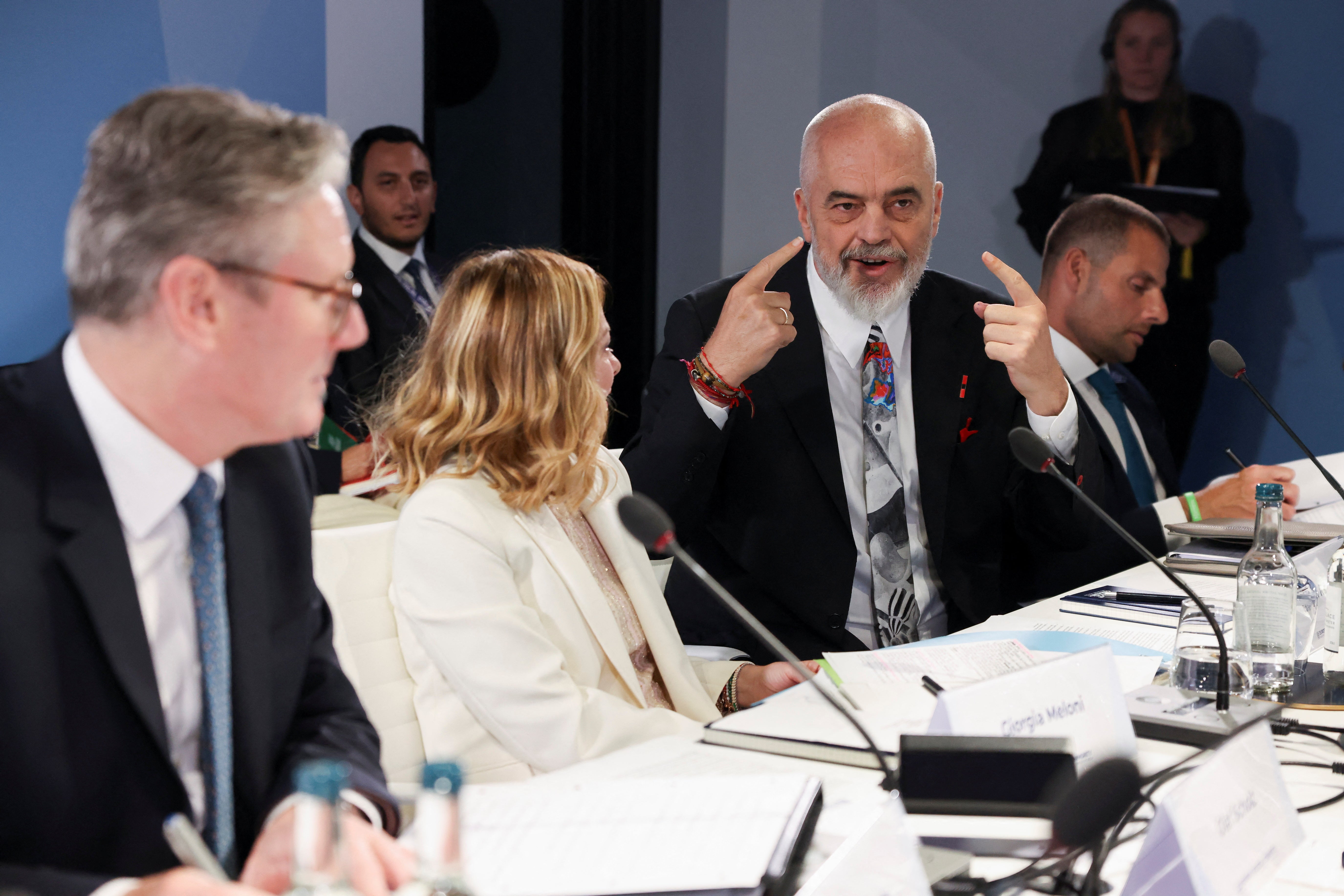 Albania's Prime Minister Edi Rama speaks to British Prime Minister Keir Starmer (L) and Italy's Prime Minister Giorgia Meloni (2nd, L) during a working session on migration at the European Political Community summit at Blenheim Palace on July 18, 2024