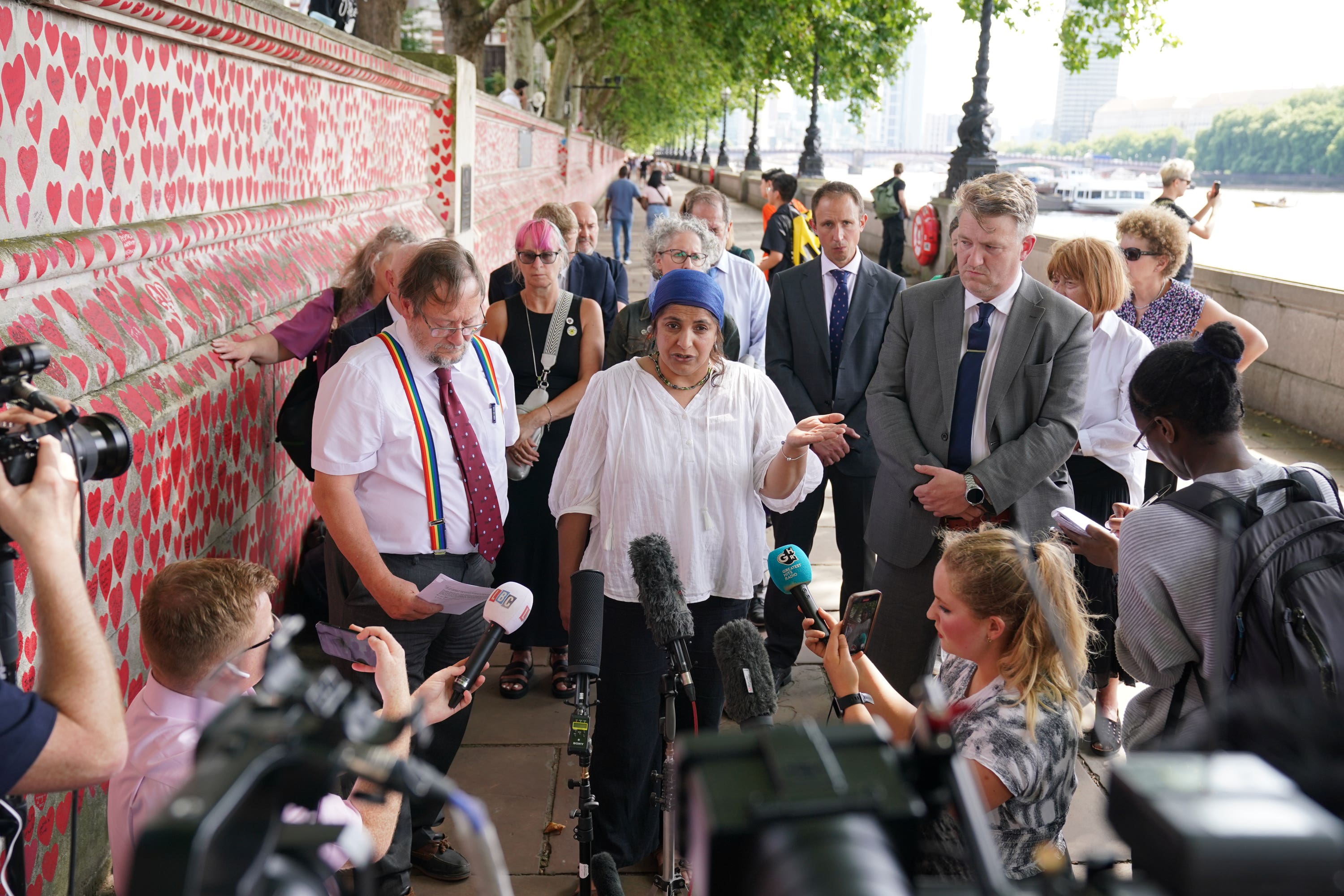 Bereaved families at the Covid Memorial Wall (Jonathan Brady/PA)