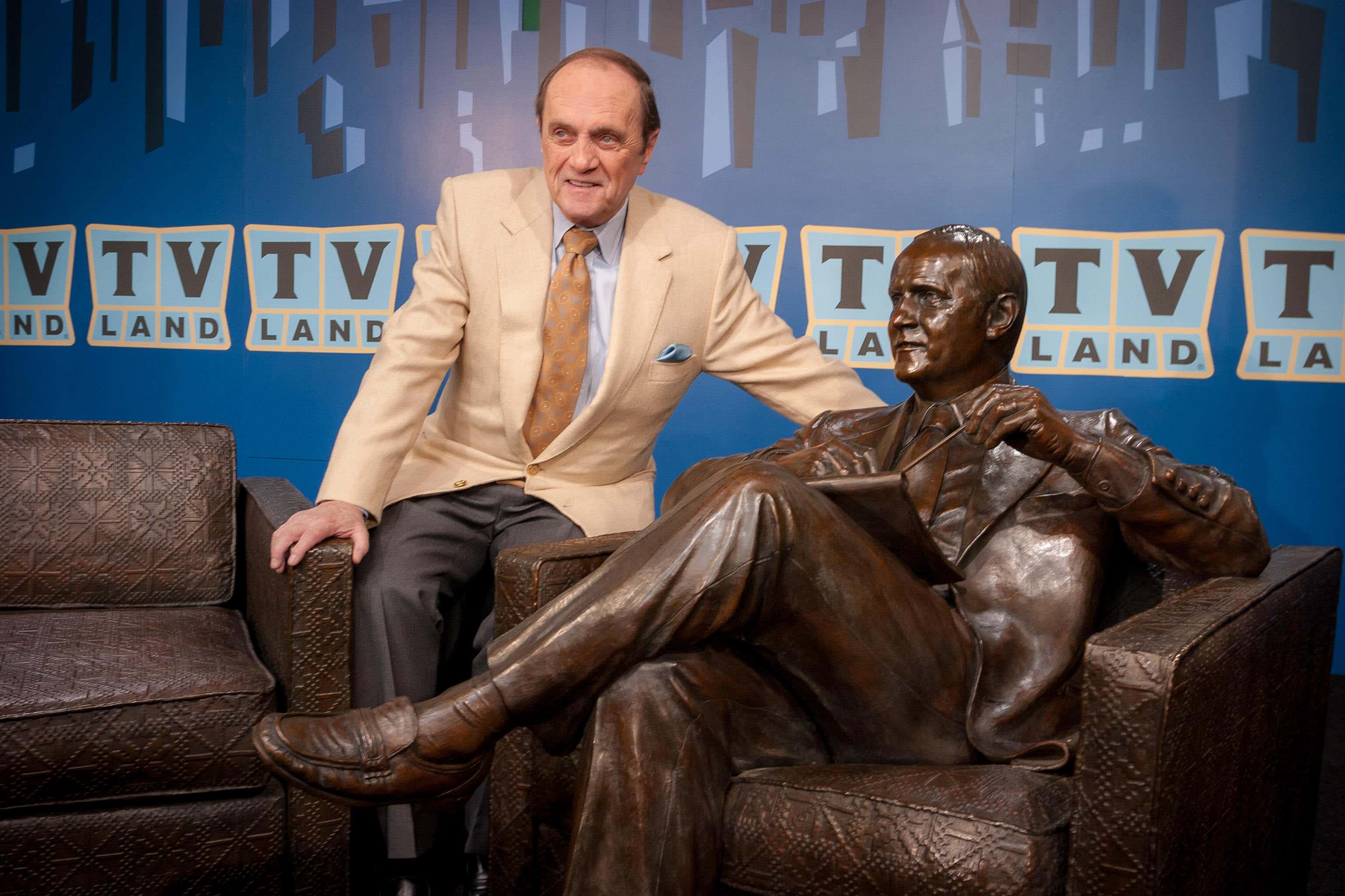 Bob Newhart with a bronze sculpture (Alamy/PA)