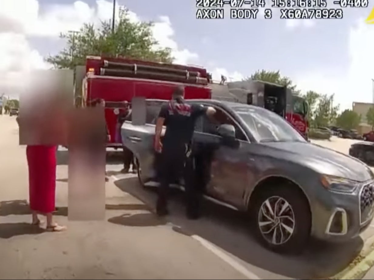 Footage from a Hollywood Police Officer bodycam in Hollywood, Florida, shows local fire crews rescuing a child that had been locked in a hot car while her mother, Anastasiya Motalava, was shopping