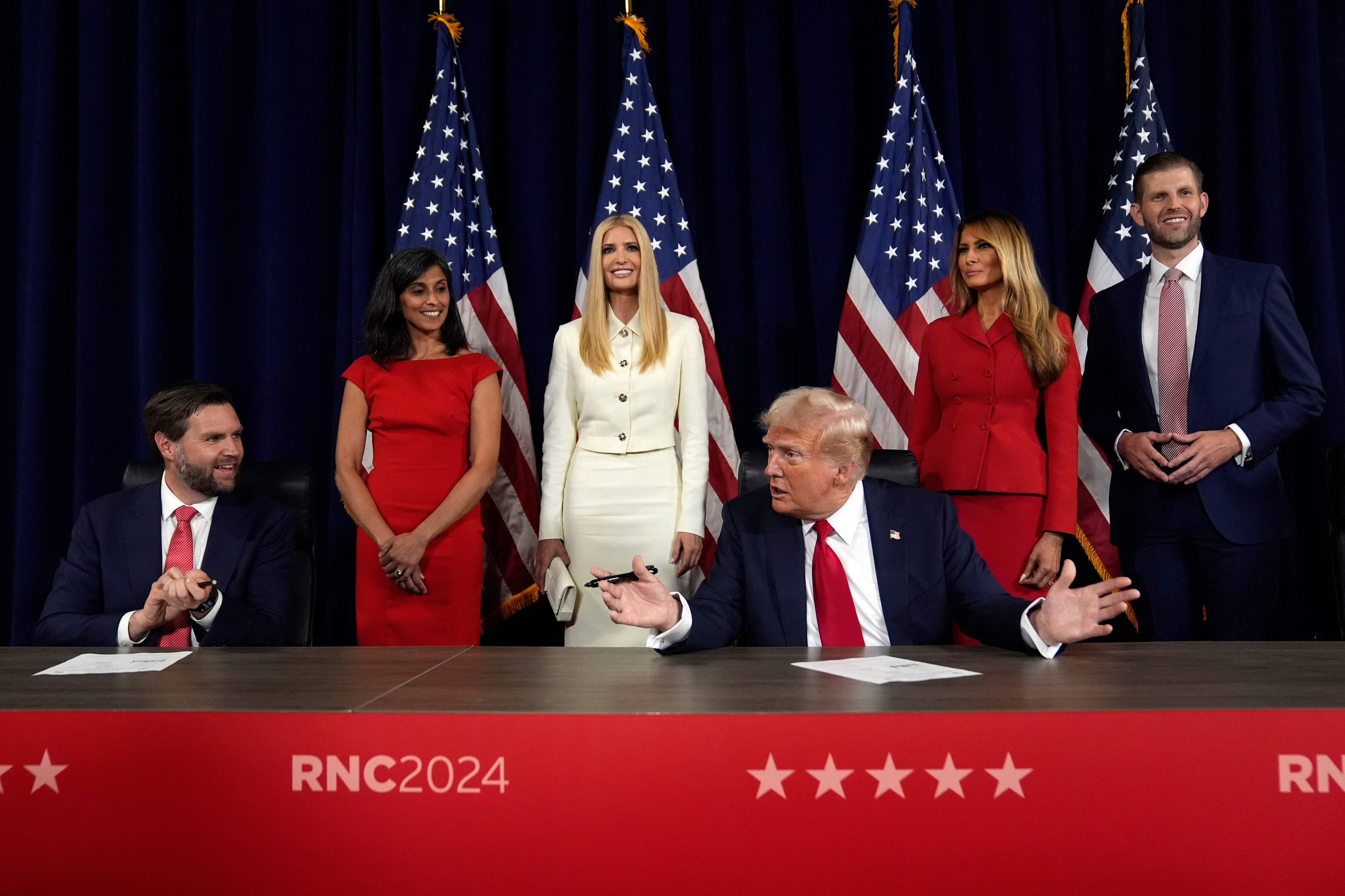 The former first lady was pictured standing behind Trump, along with Ivanka Trump as he signed paperwork to officially accept the Republican nomination for presidential candidate