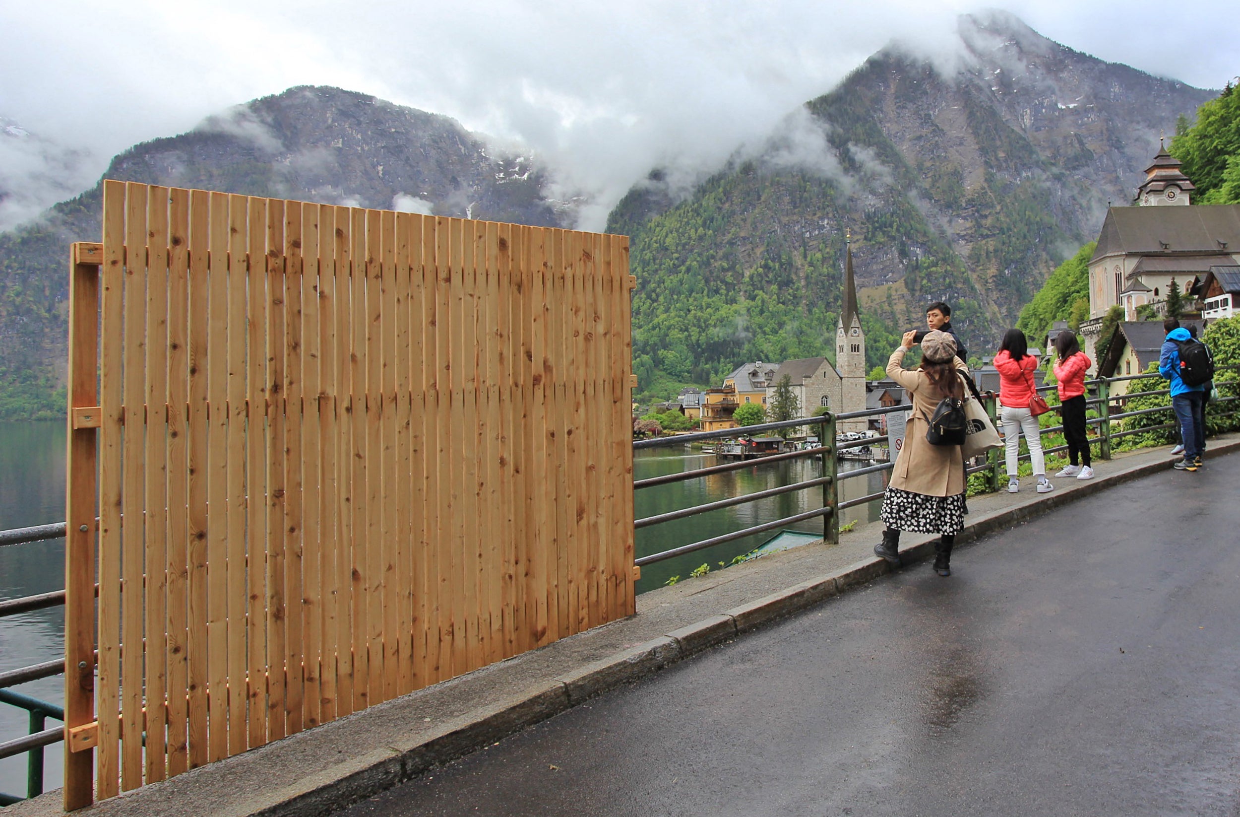 A wooden wall blocks a popular tourist selfie spot in Hallstatt, Austria