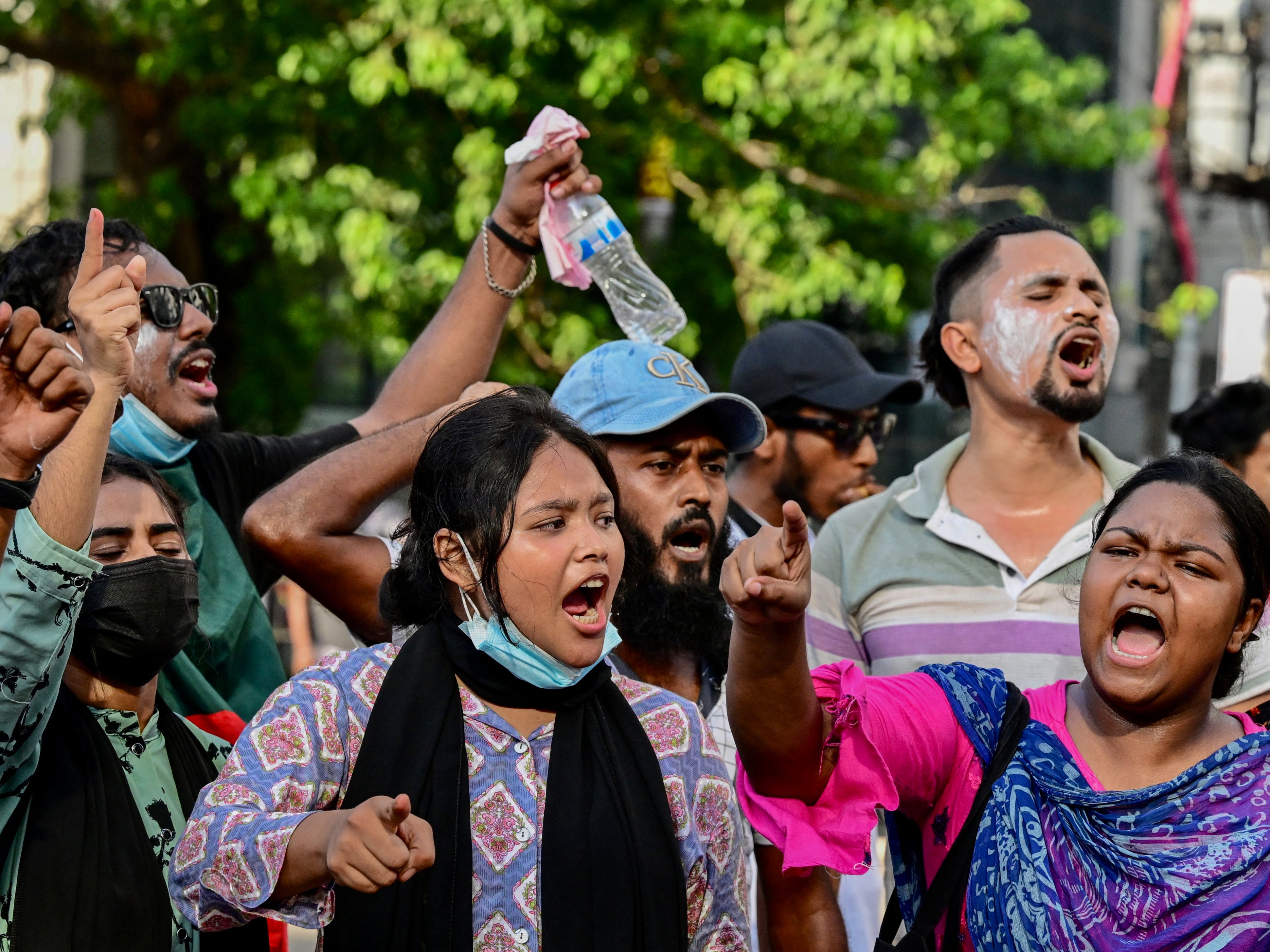 Students shout slogans during protests in Dhaka on 18 July 2024