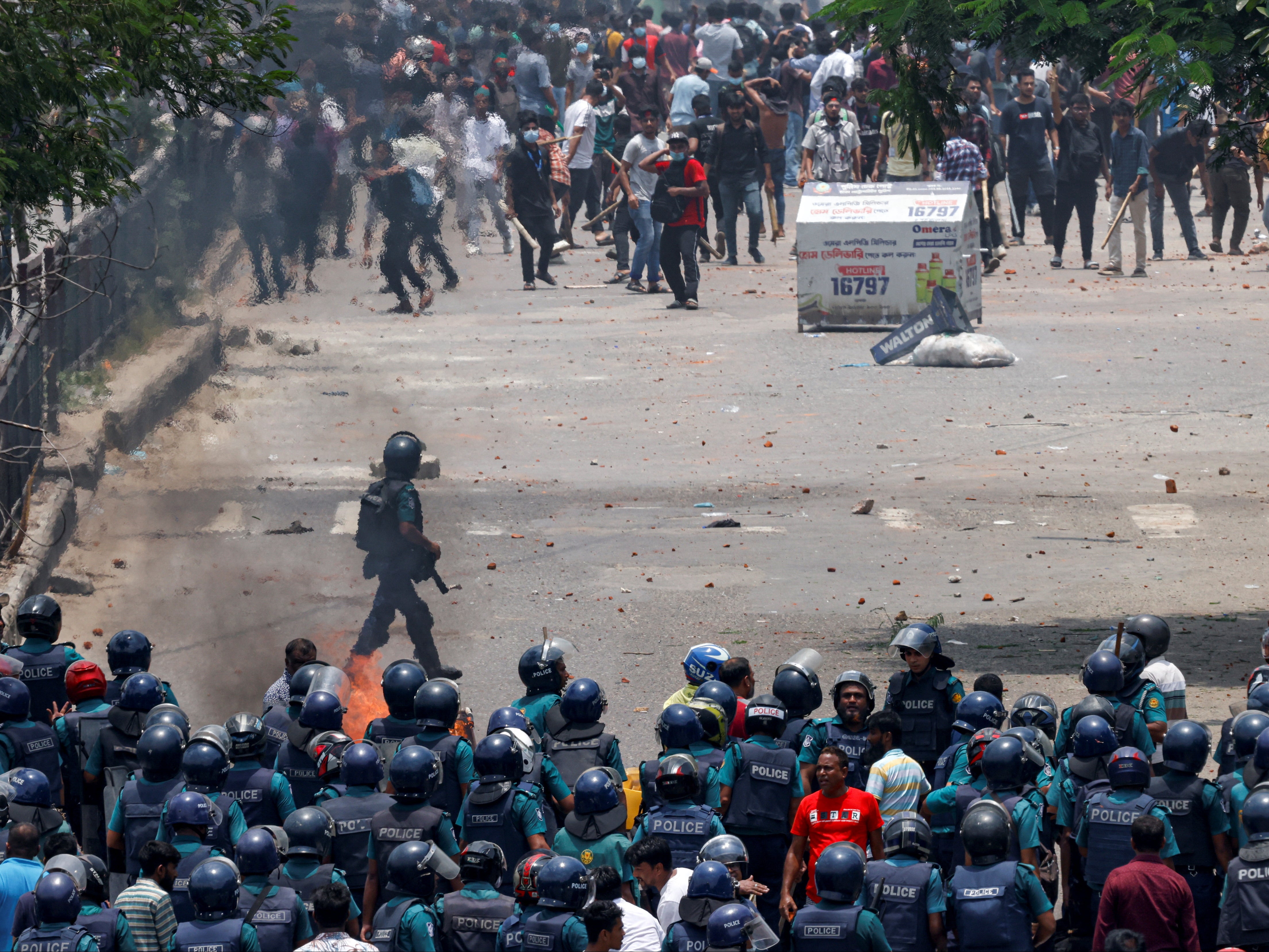 Protesters clash with police and supporters of the ruling Awami League party in Dhaka on 18 July 2024