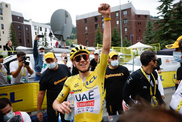 <p>Tadej Pogacar celebrates after victory on stage 19</p>