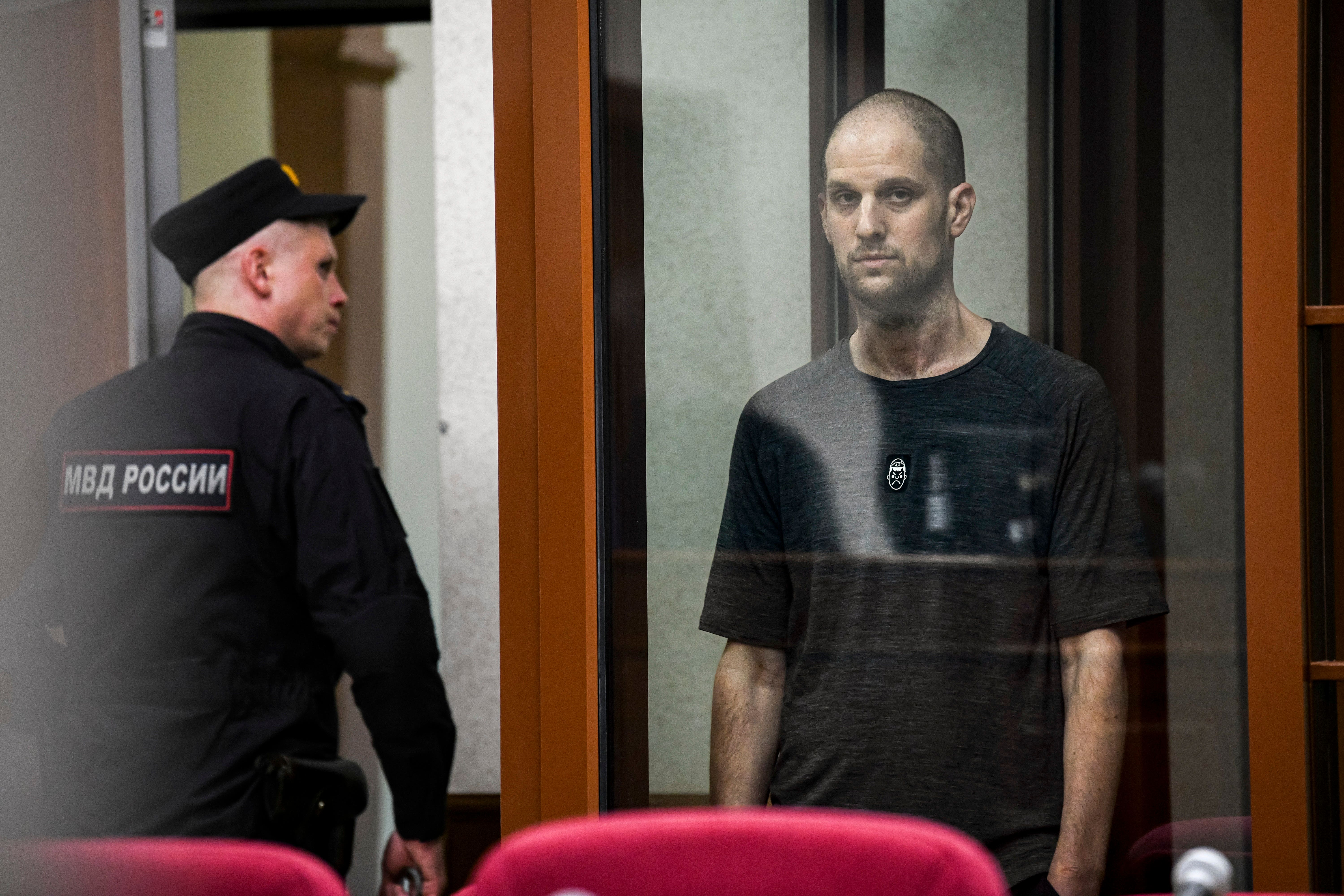 Evan Gershkovich stands listening to the verdict in a glass cage last week. The number of US hostages or wrongfully detained individuals is on the decline