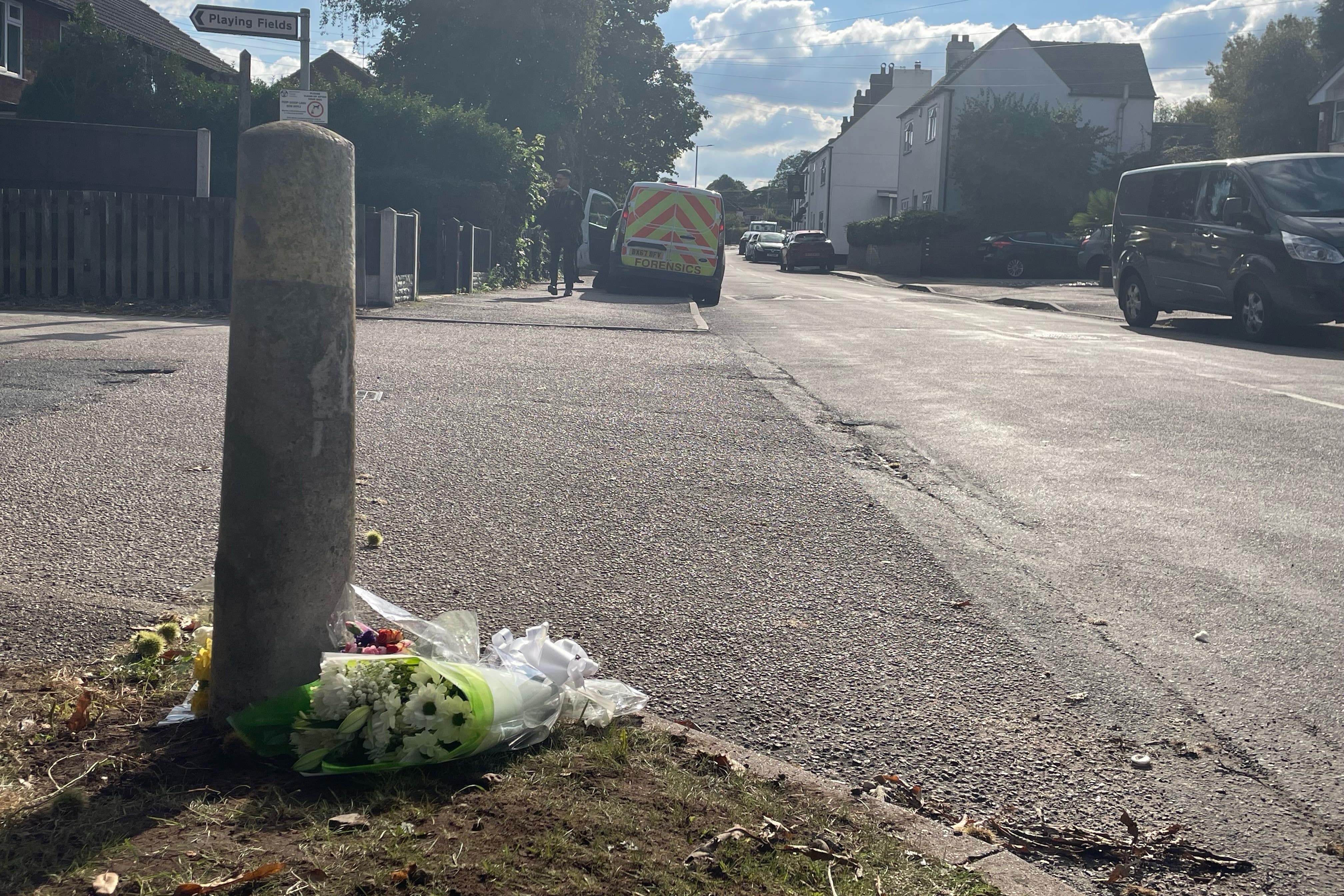 Floral tributes outside a property in Main Street, Stonnall, Staffordshire (PA)