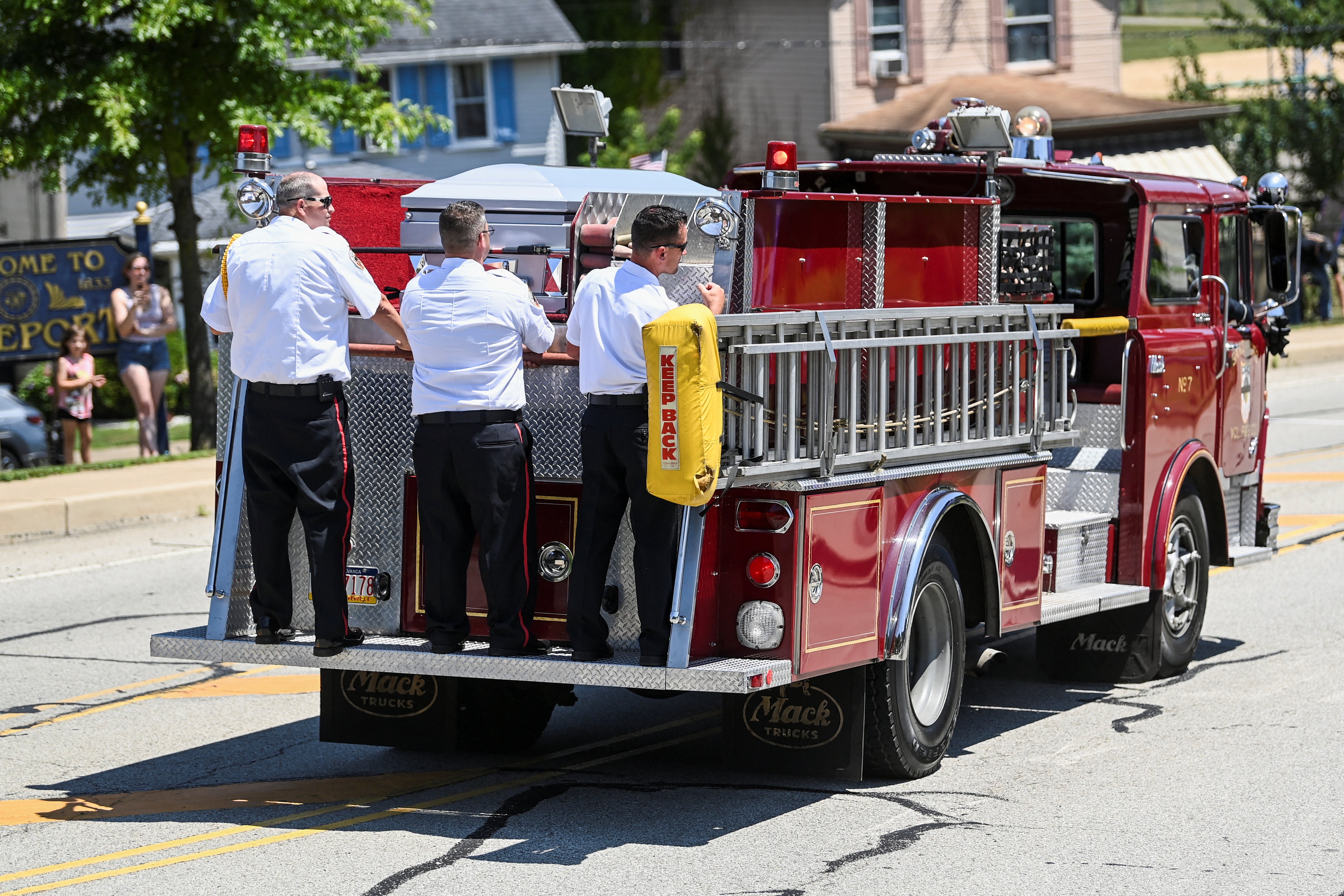 A firetruck transported Comperatore’s casket