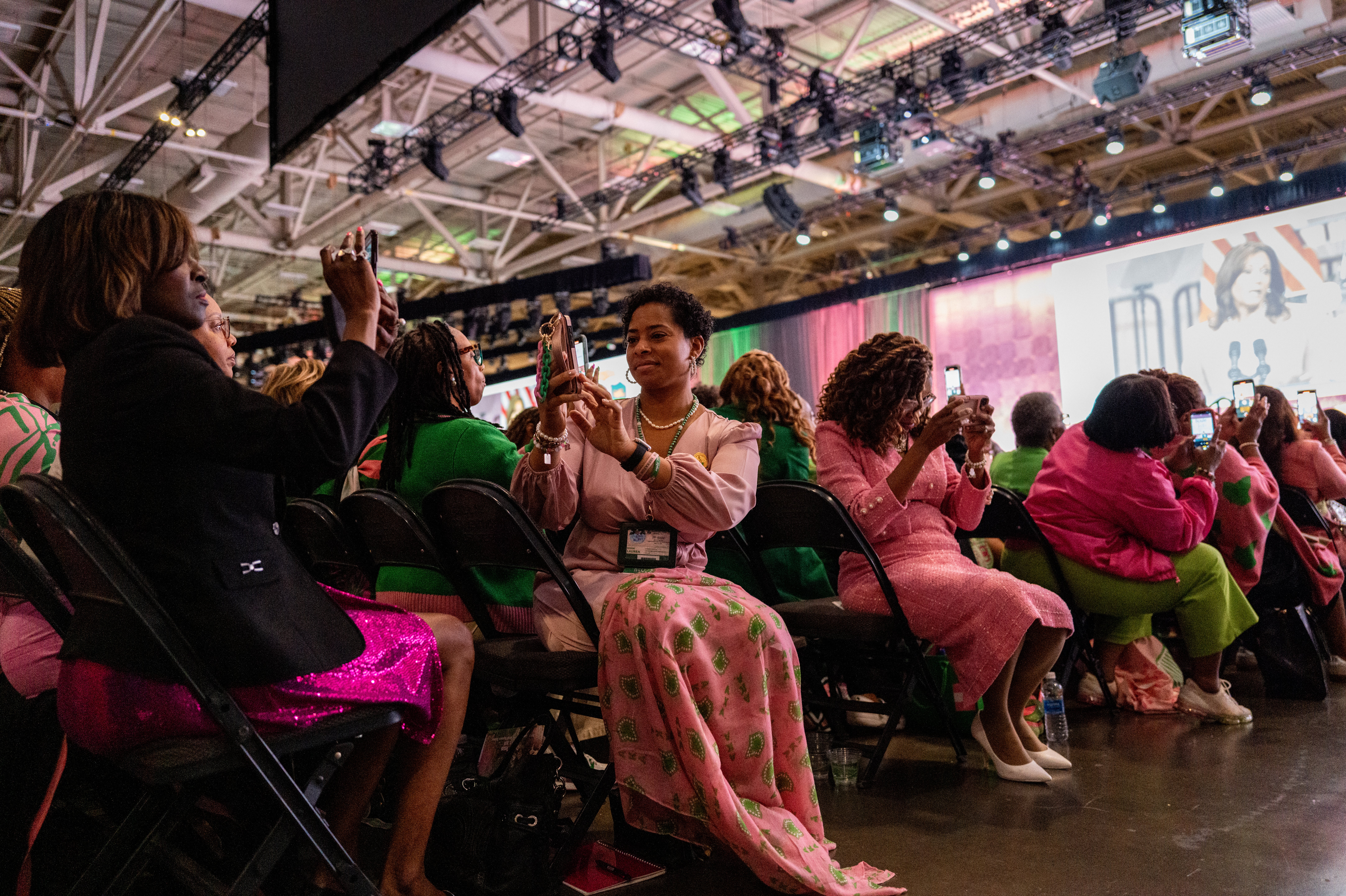 Members of the Alpha Kappa Alpha Sorority take photos as Harris, one of their own, spoke to 20,000 members earlier this month in Dallas, Texas