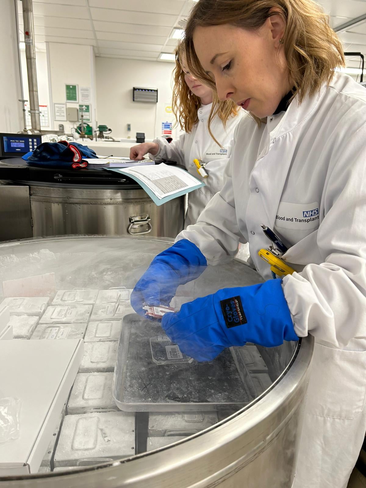 Staff from NHS Blood and Transplant take the frozen cord stem cells out of storage in preparation for Gunner’s transplant