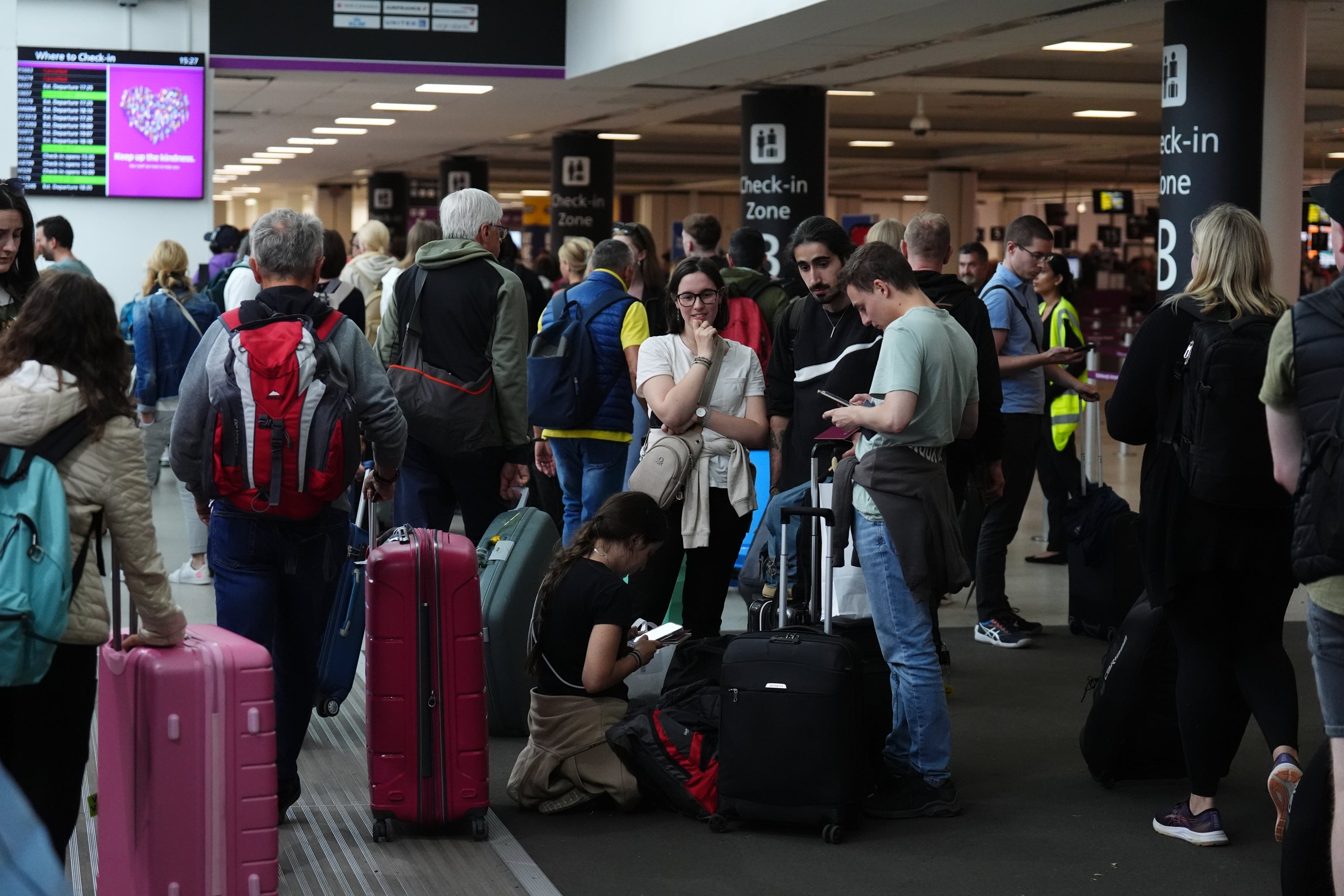 Passengers waiting at Edinburgh Airport as the outages led to long queues at airports