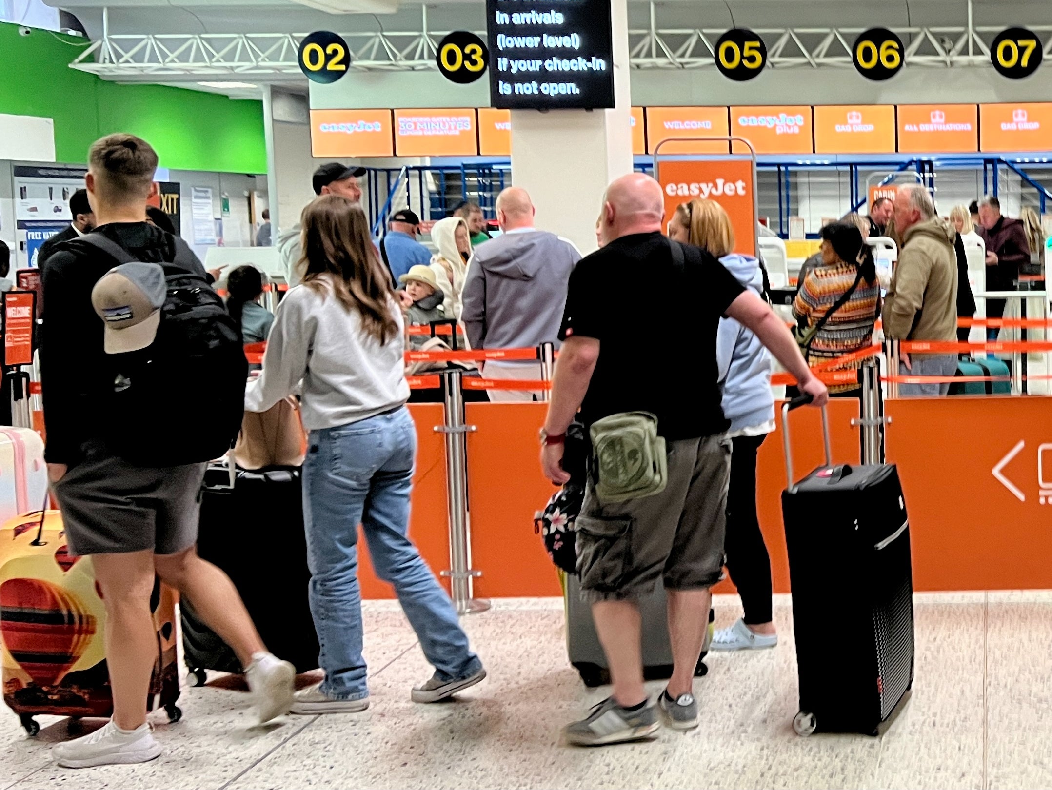 Going places: EasyJet passengers at Manchester airport