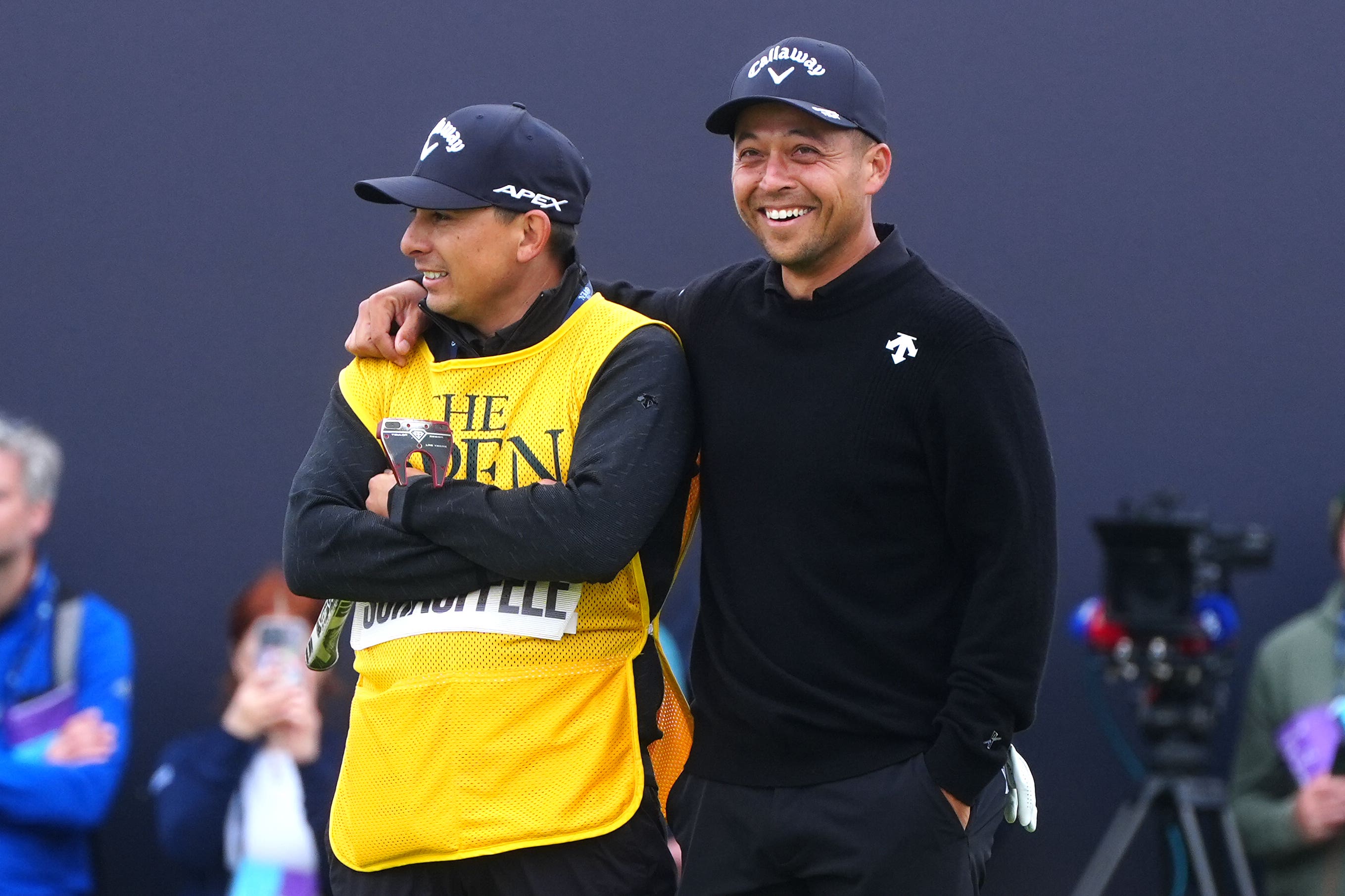 Xander Schauffele (right) celebrates with caddie Austin Kaiser after winning The 152nd Open