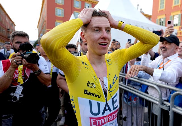 <p>Tadej Pogacar reacts after clinching his third Tour de France win</p>