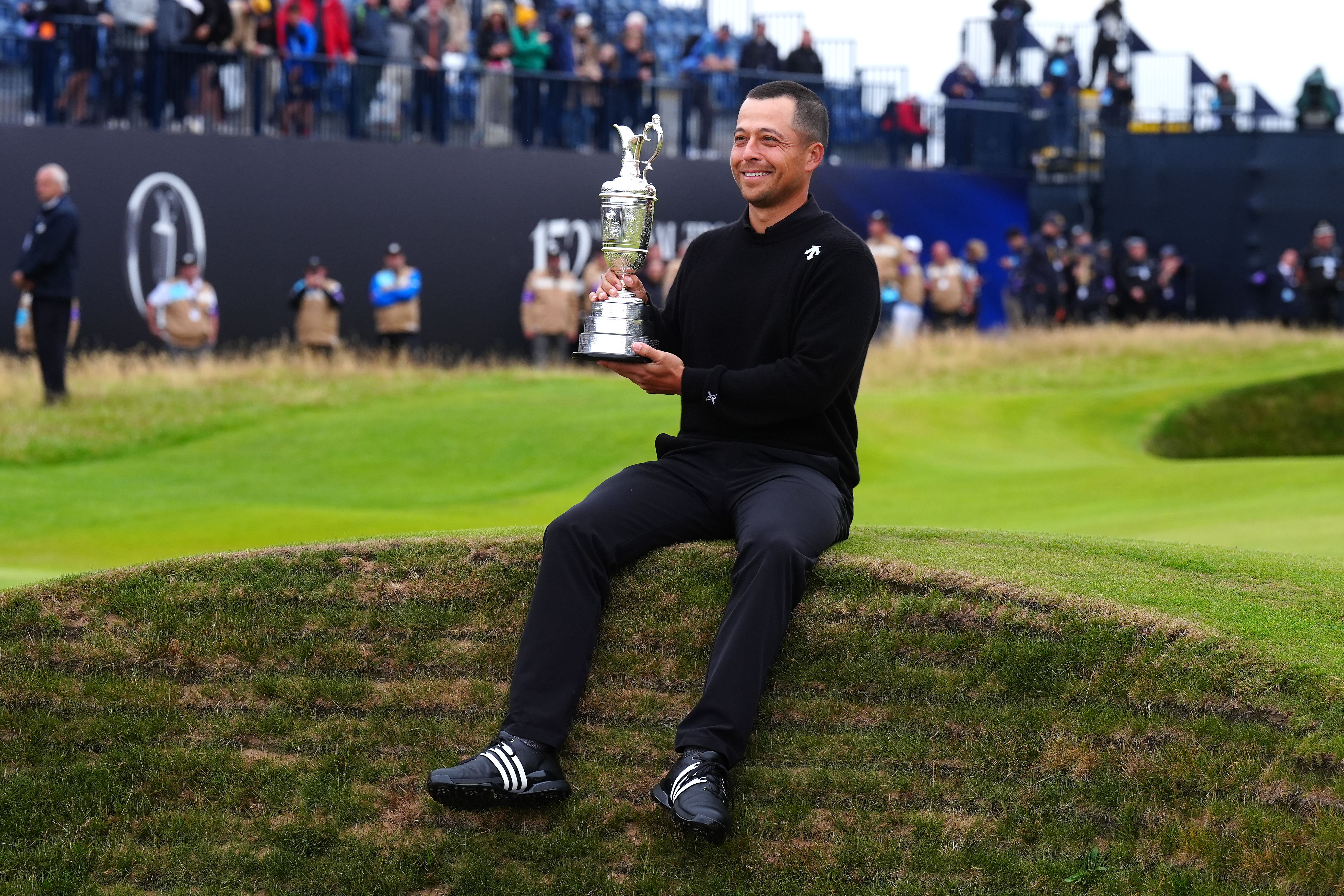 Xander Schauffele celebrates with the Claret Jug