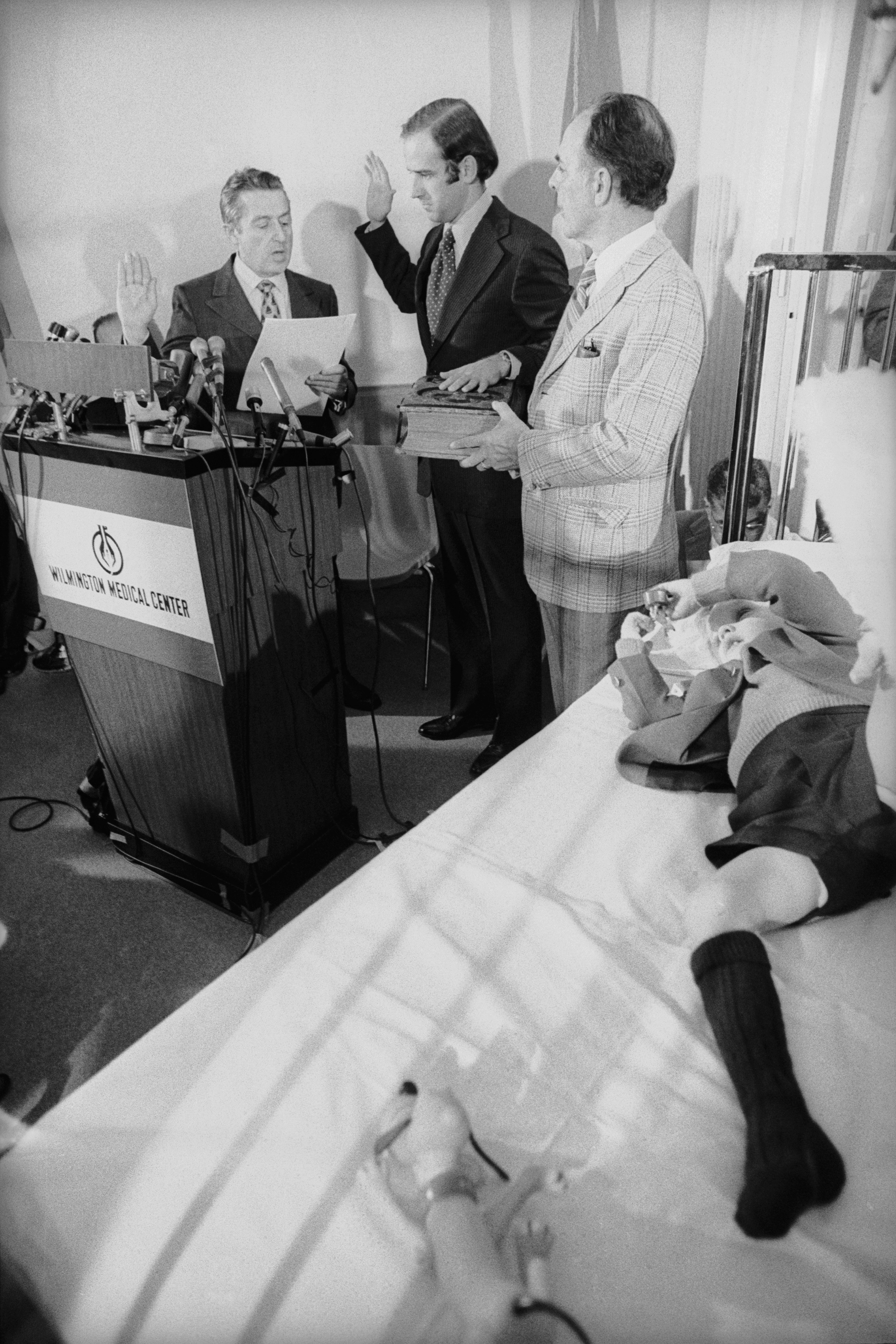 Senator Joseph Biden takes the oath of office from the U.S. Senate’s secretary, Frank Valeo, with his father-in-law Robert Hunter and son Joseph Beau Biden at his side, in Beau’s hospital room