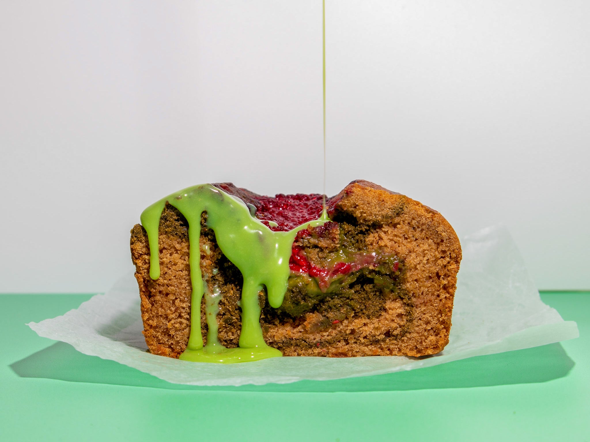 A delightful loaf of vegan matcha raspberry cake, blending the tartness of fresh raspberries with the earthy richness of matcha