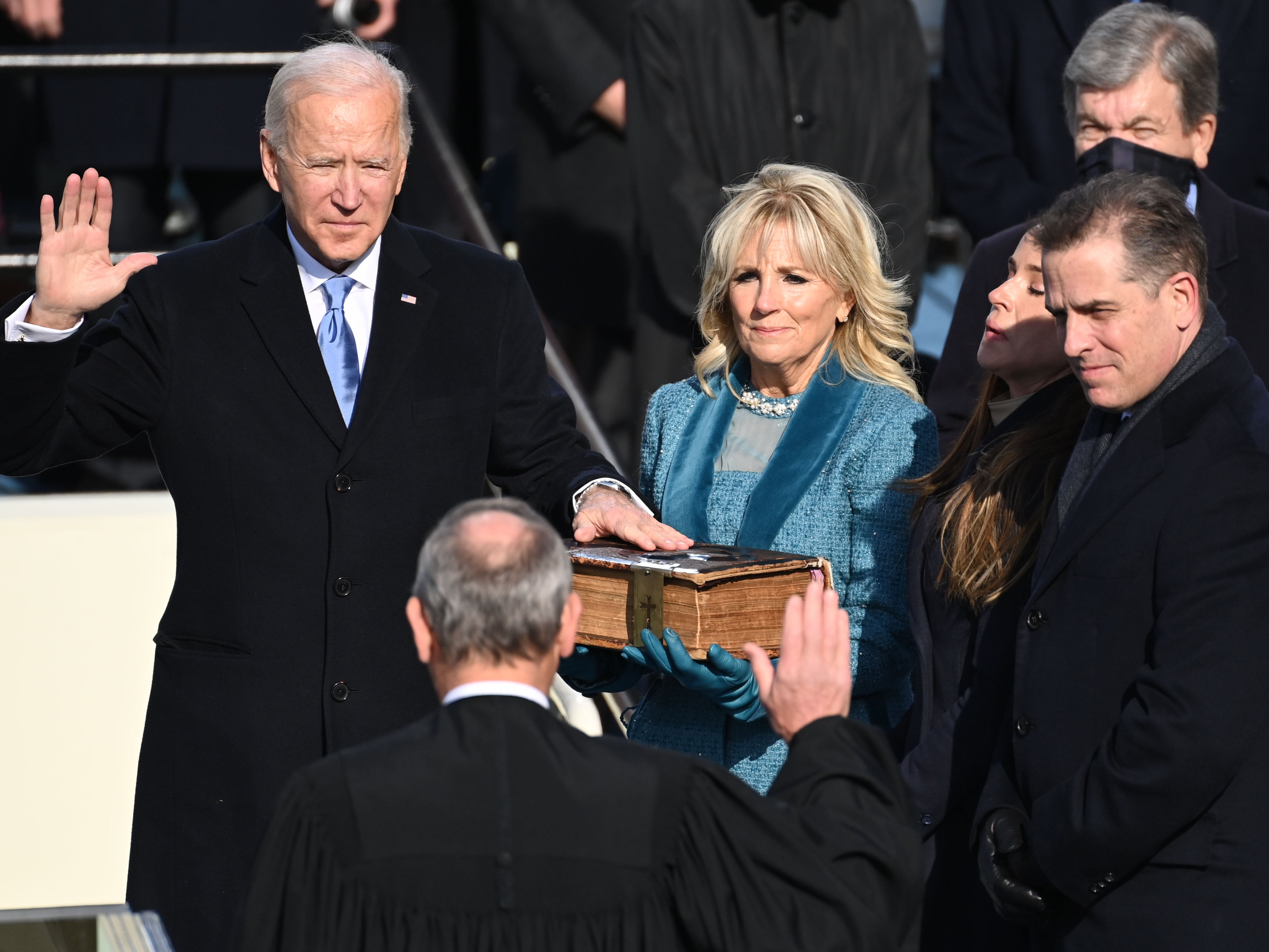 Biden is sworn in as his wife Jill holds the Bible during the 59th presidential inauguration ceremony in 2021