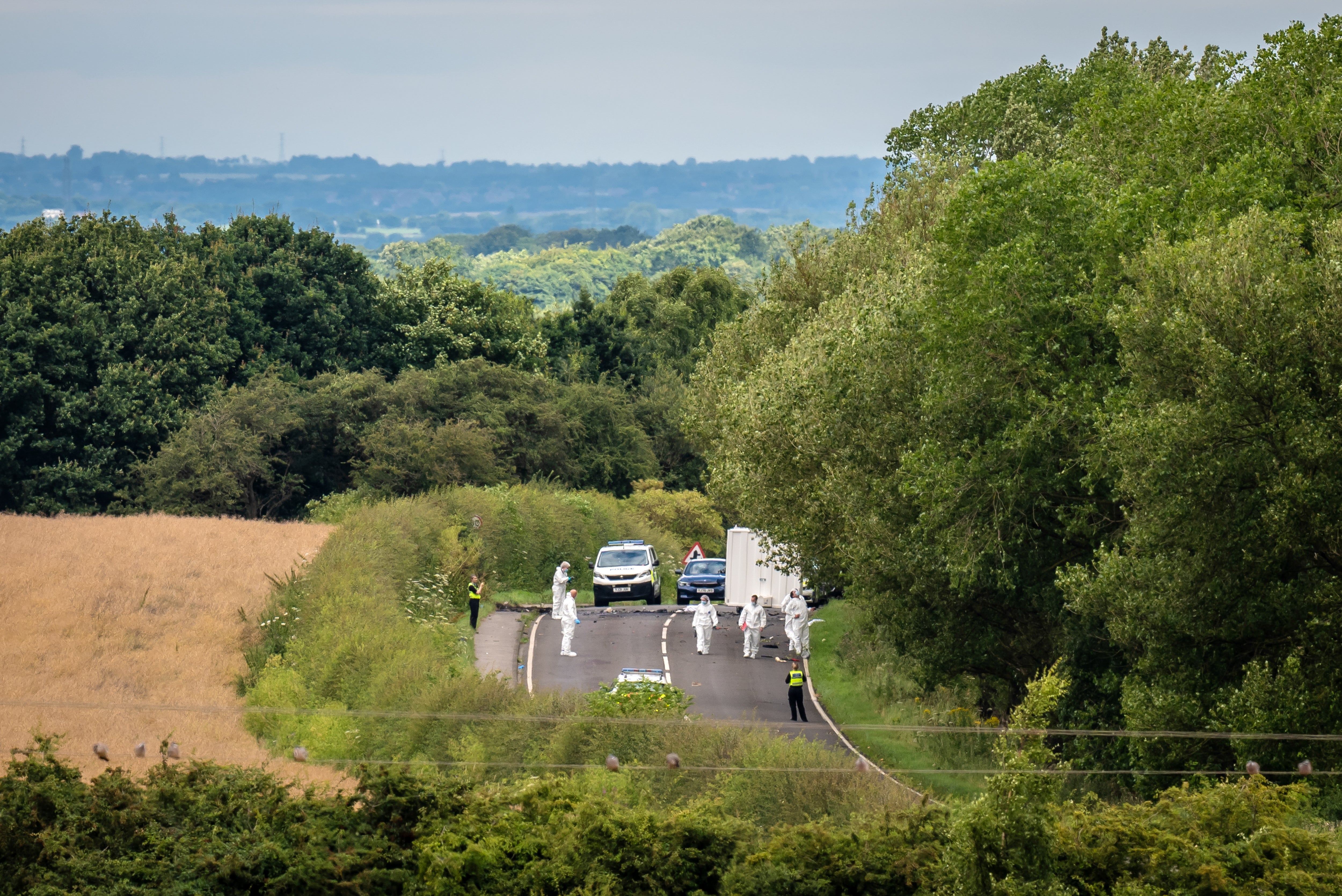 Forensic officers at the scene following the tragedy on the A61 in Wakefield