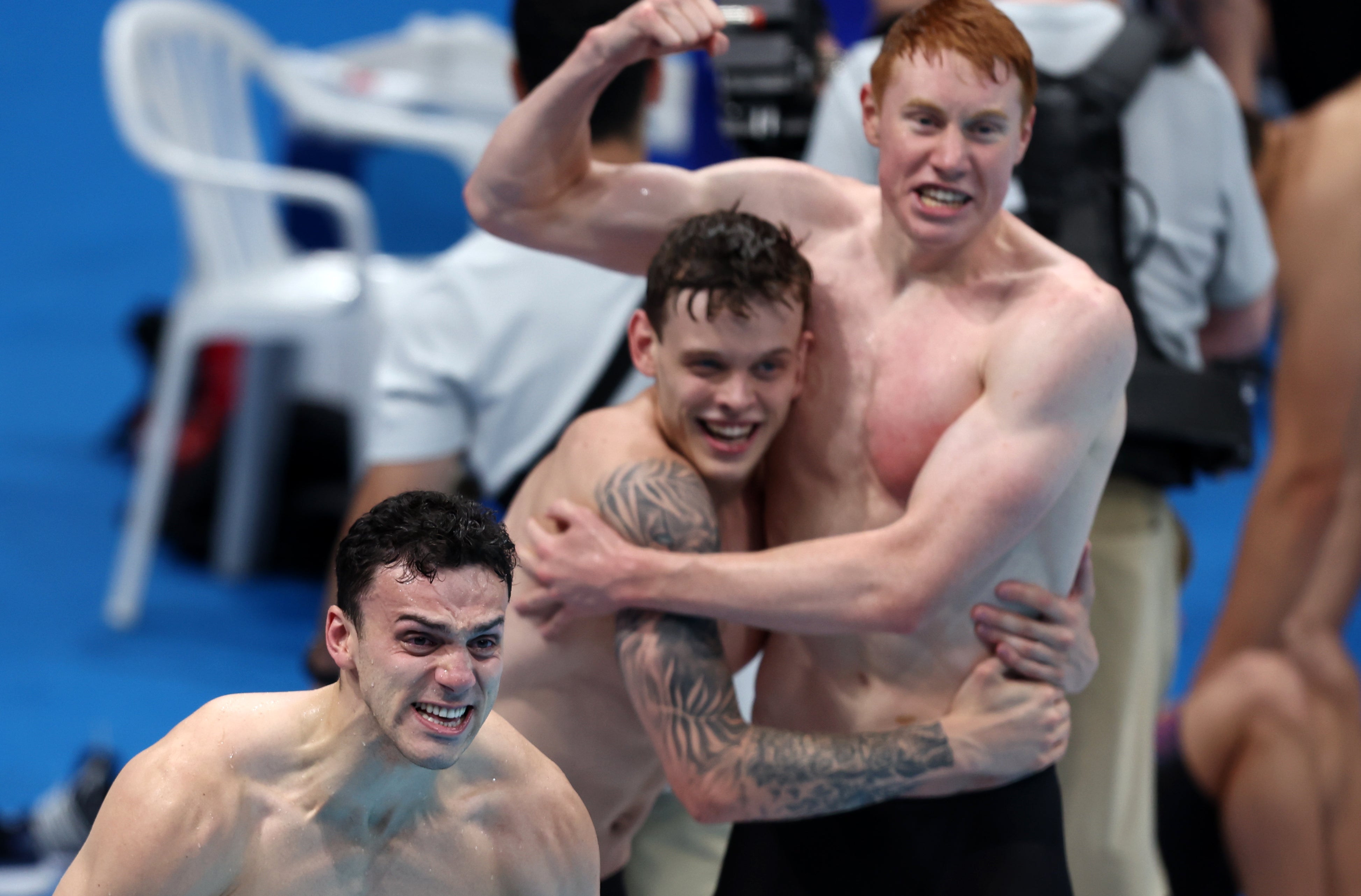 James Guy, Matt Richards and Tom Dean react as teammate Duncan Scott brings home gold in the Men’s 4 x 200m Freestyle Relay at Tokyo 2020